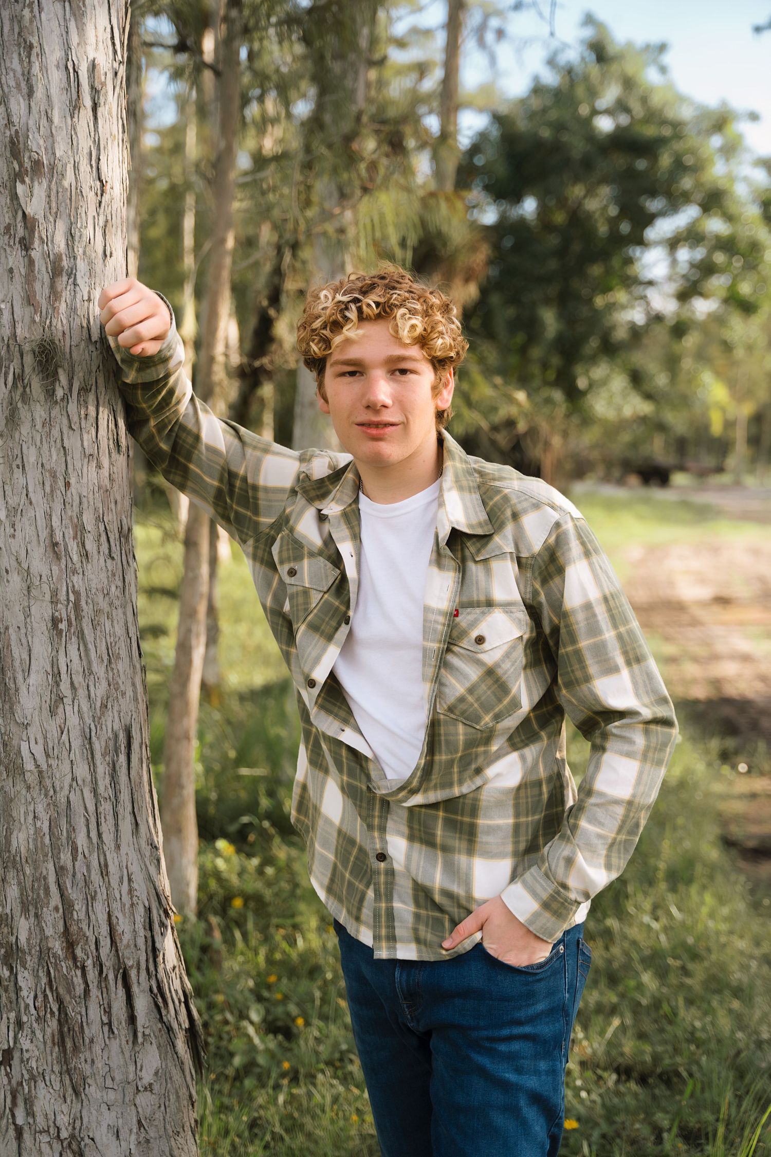 A series of casual outdoor portraits showing a plaid shirt and jeans outfit against a wooded background.