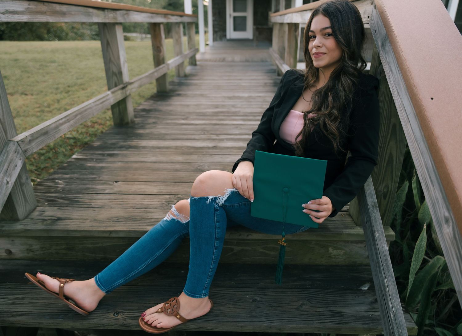 Relaxed lifestyle photography session on wooden boardwalk at sunset.