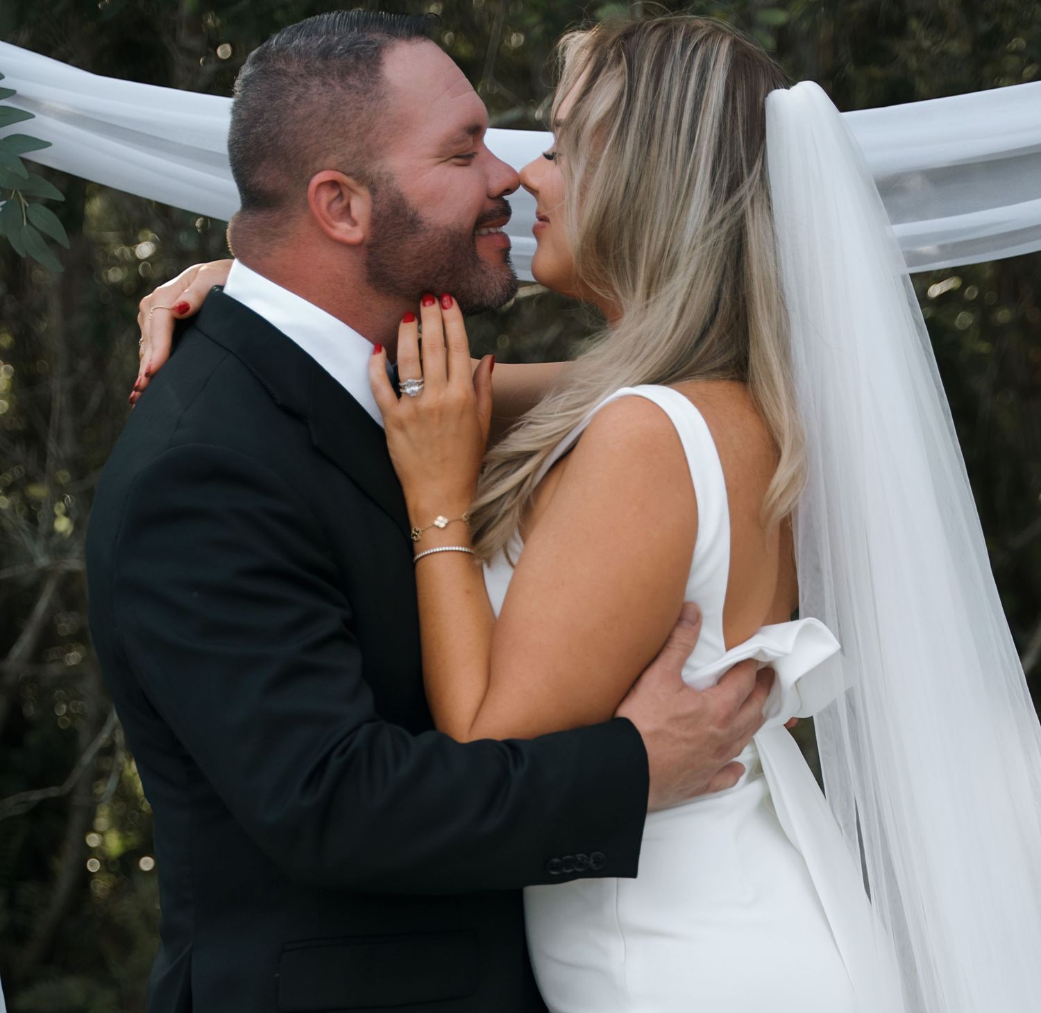Wedding sequence showing romantic moments between newlyweds with flowing veil.