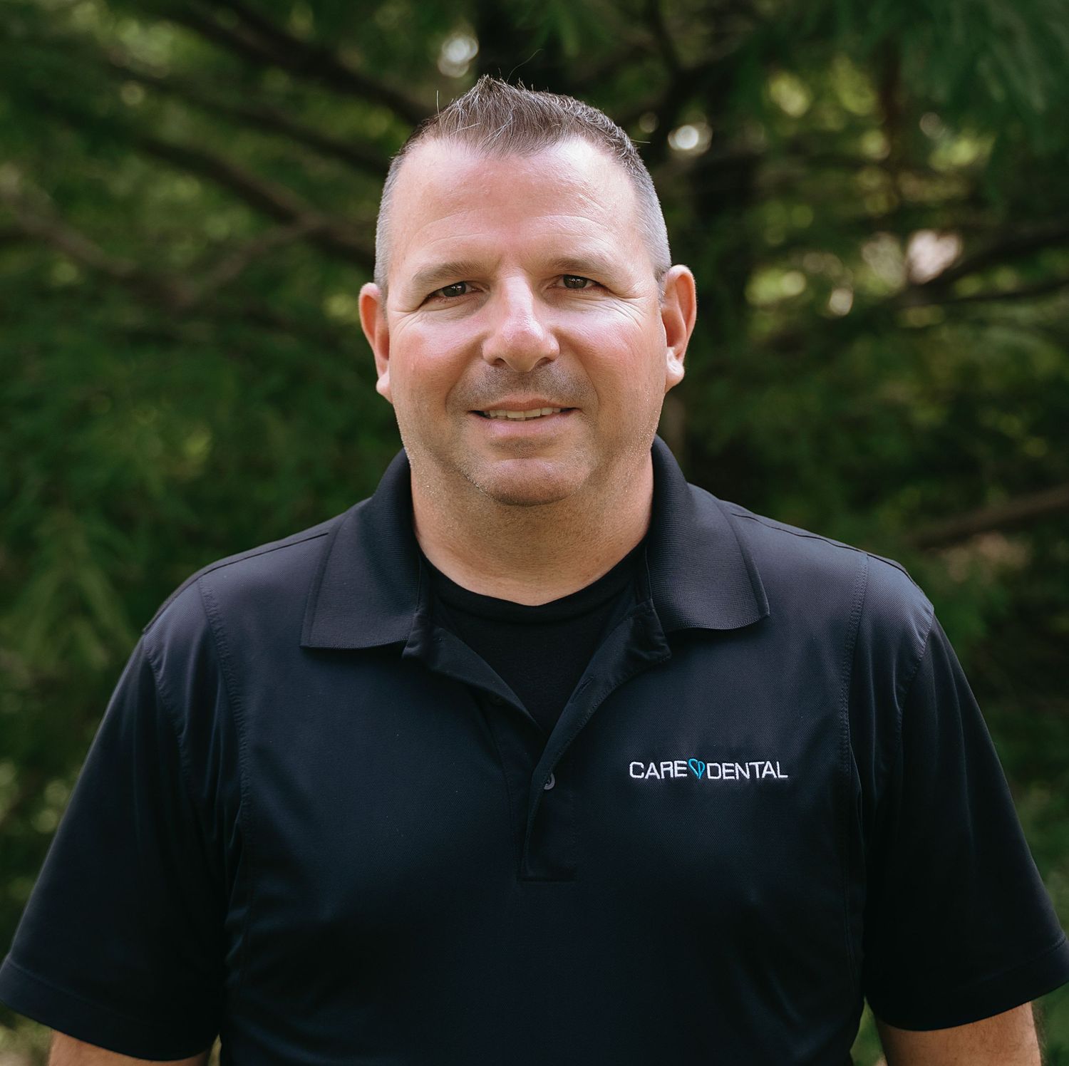 Series of professional headshots showing friendly expressions in company uniform.