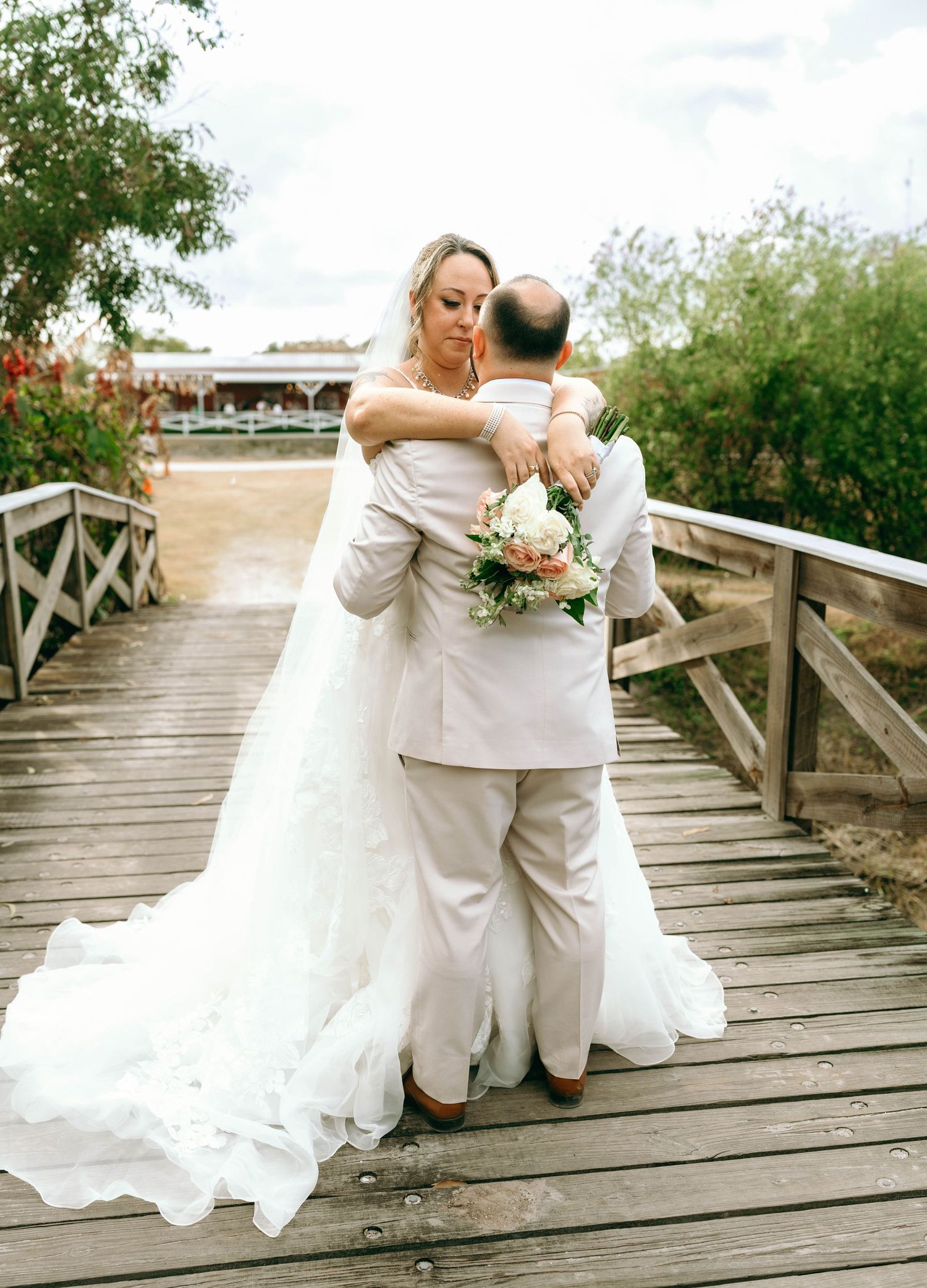 A romantic wedding photo sequence shows a couple in white and beige dancing on a wooden boardwalk outdoors.