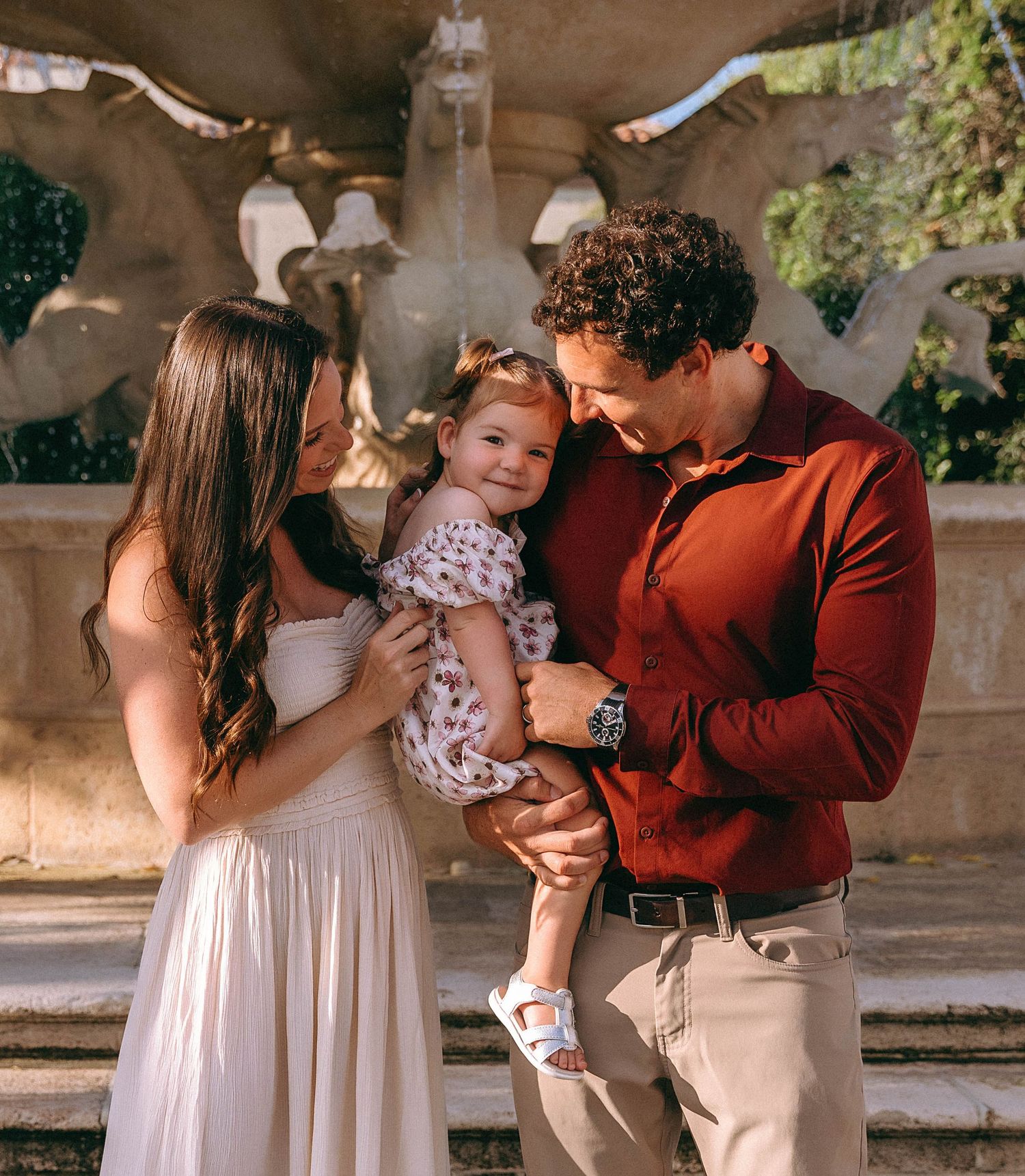 Sweet candid moments captured on elegant outdoor stone steps.