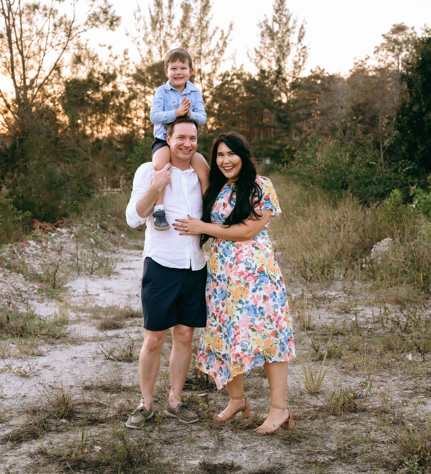 Candid family moments captured in a series of playful poses against a natural backdrop.