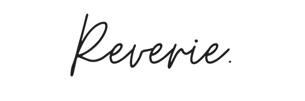 Handwritten text reading 'Reverie' in elegant cursive script.