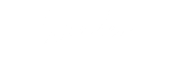 A handwritten wedding invitation with elegant script text.