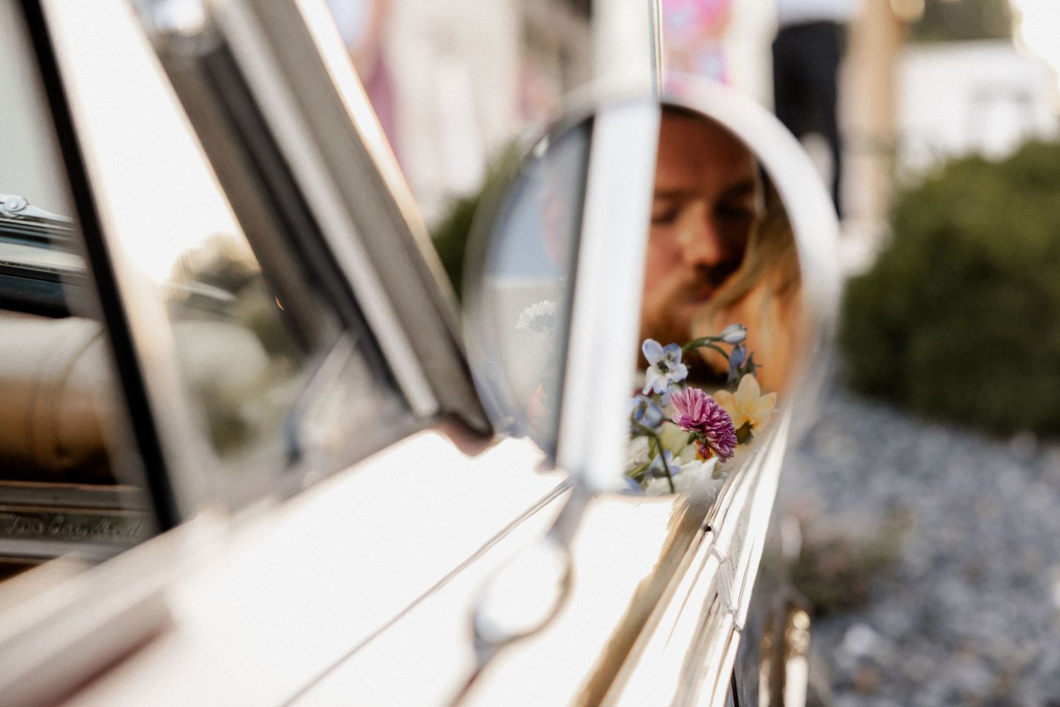 Classic vintage car decorated with flowers and wedding decor.