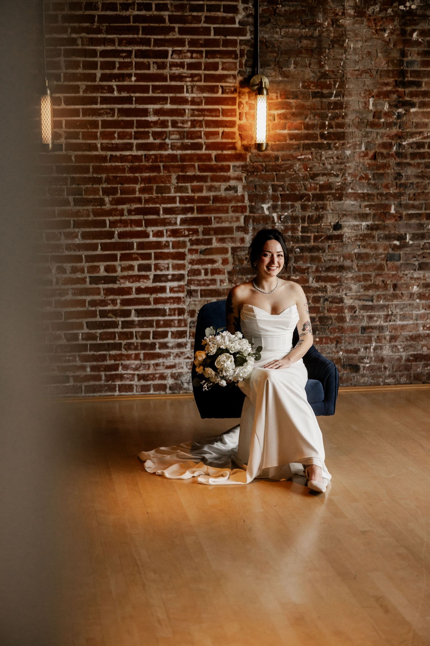 Artistic sequence of bridal portraits against rustic brick wall with hardwood floors.