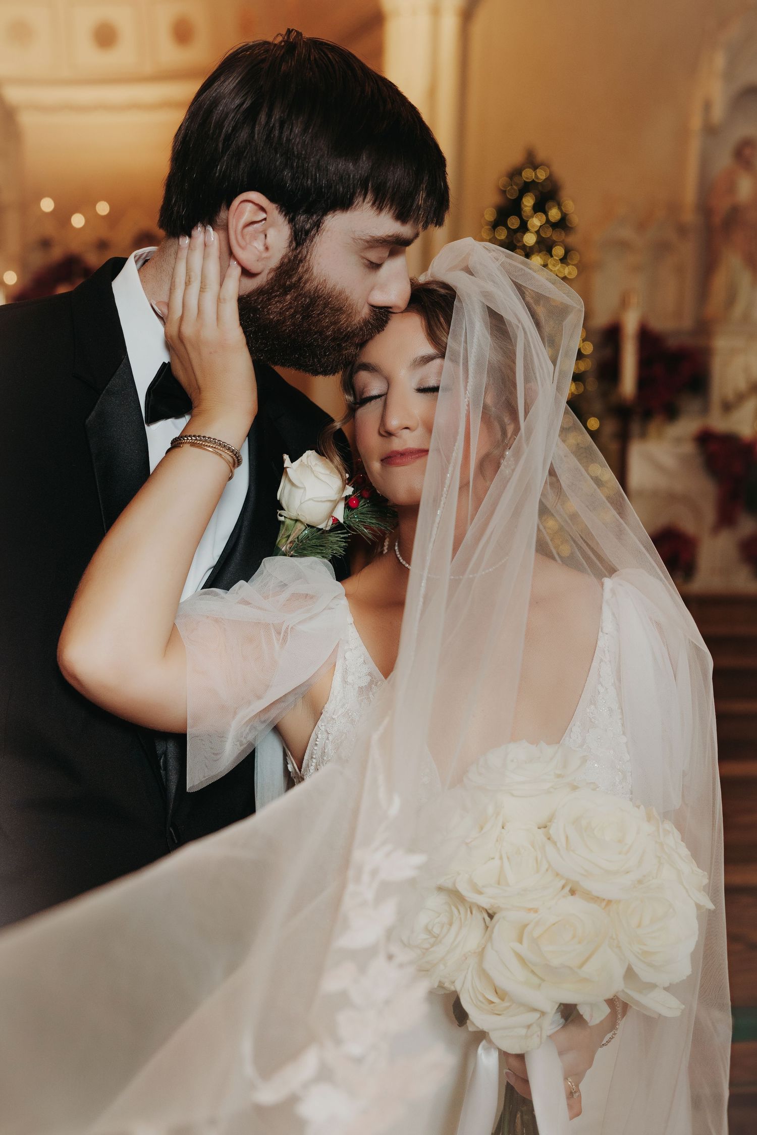 Intimate wedding photography sequence showing tender moments with white roses and veil at St. Dominic Catholic Church