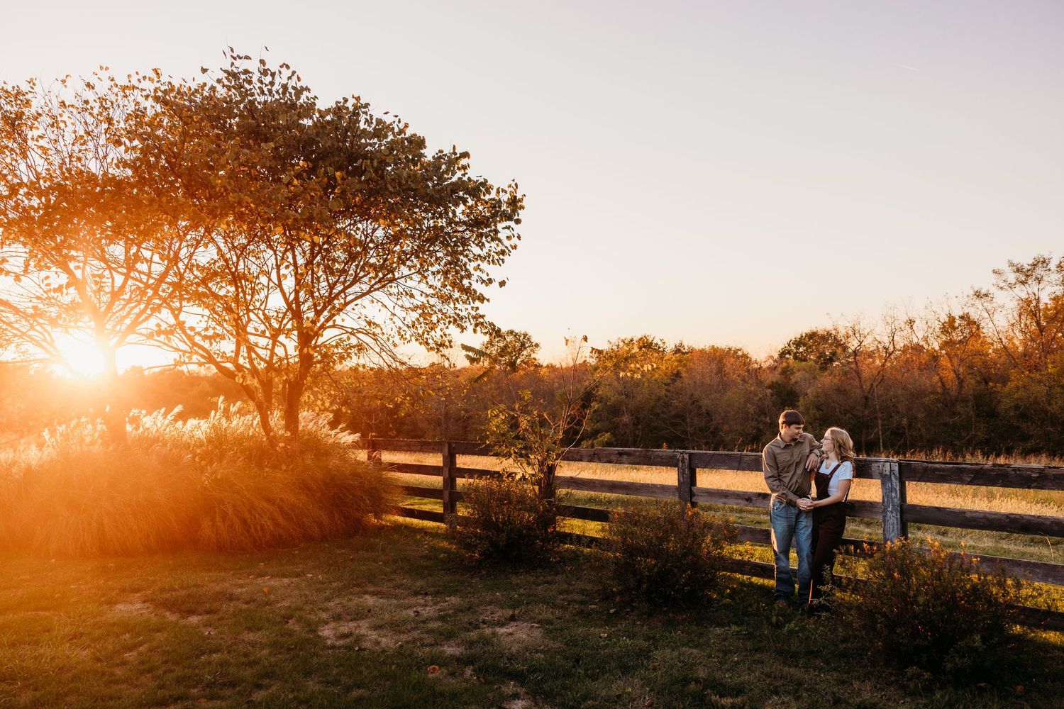 Sunset landscape photography with silhouettes and warm orange glow.