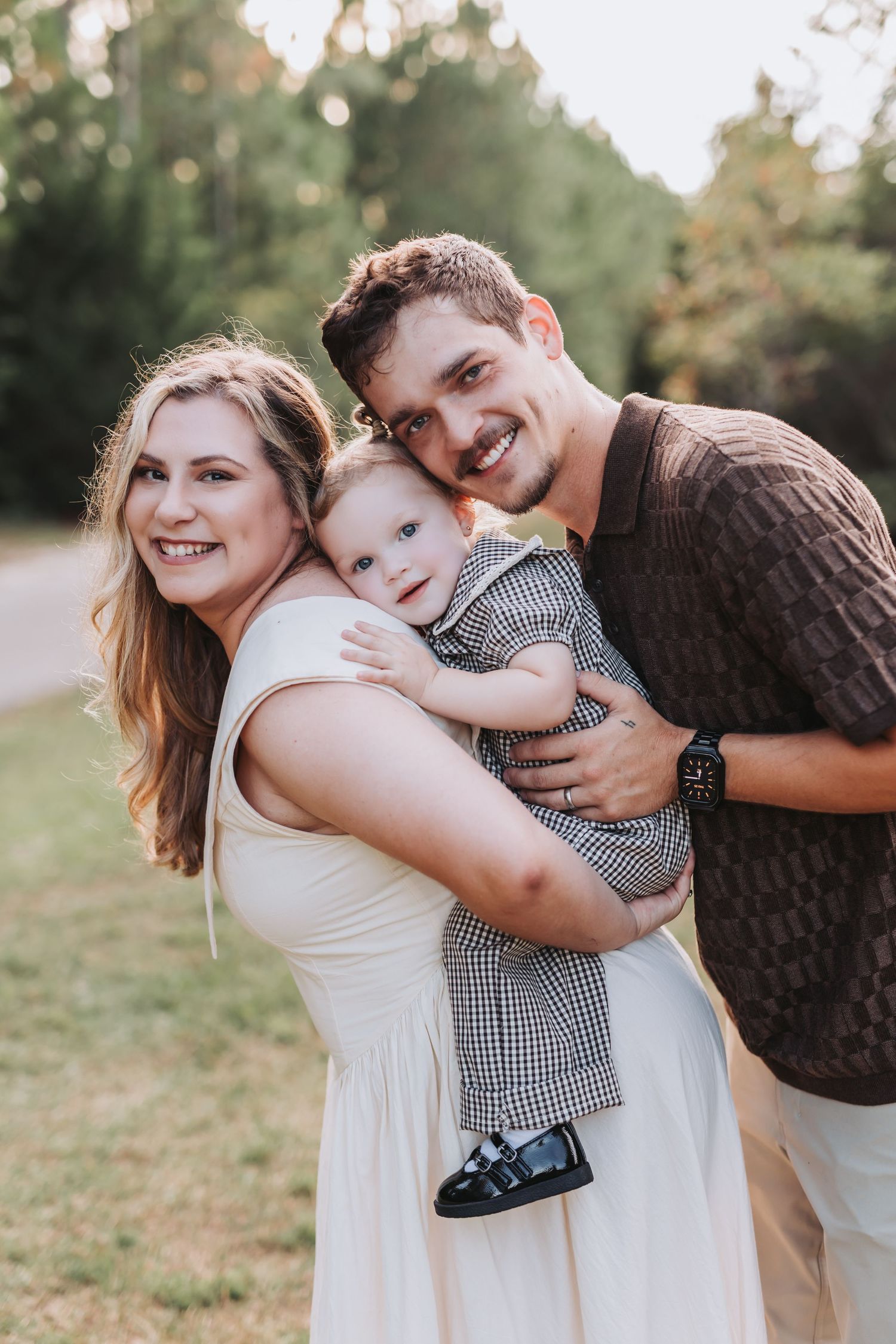 A family shares playful moments together in a series of candid outdoor photos at sunset.