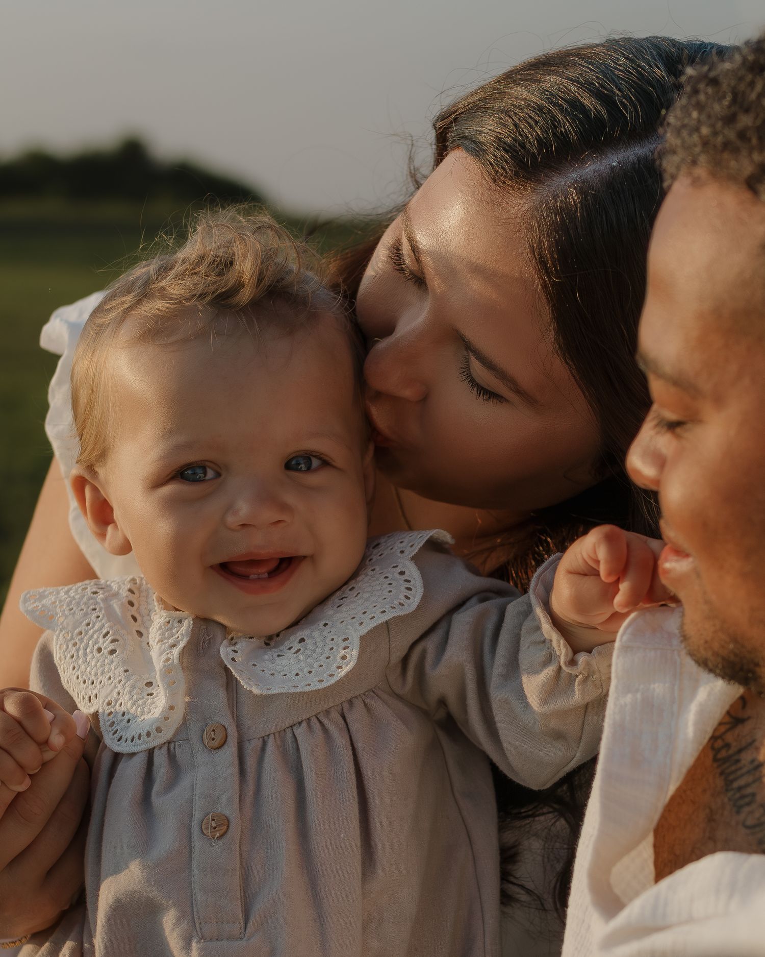 Joyful family moment captured in golden evening light.