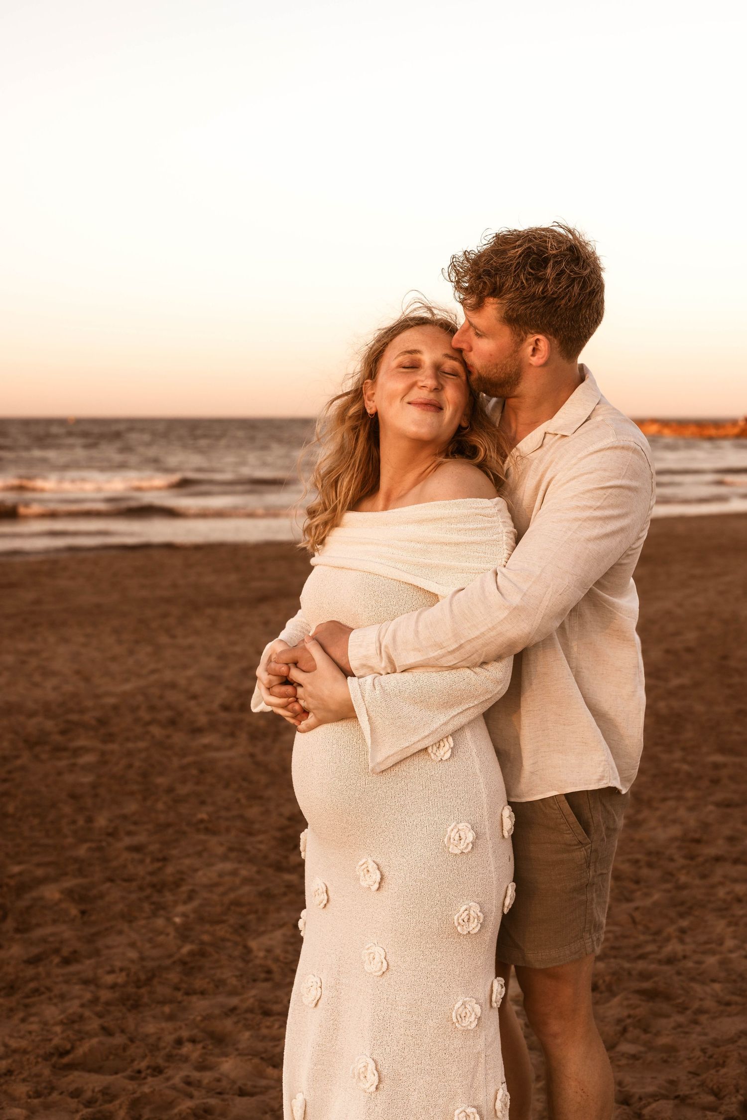 Maternity photographer in Javea capturing an expecting mother at golden hour, storytelling and emotional photography