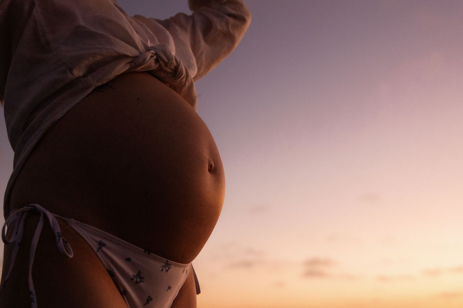 Baby bump at sunrise, solo maternity session at waimari beach, christchurch