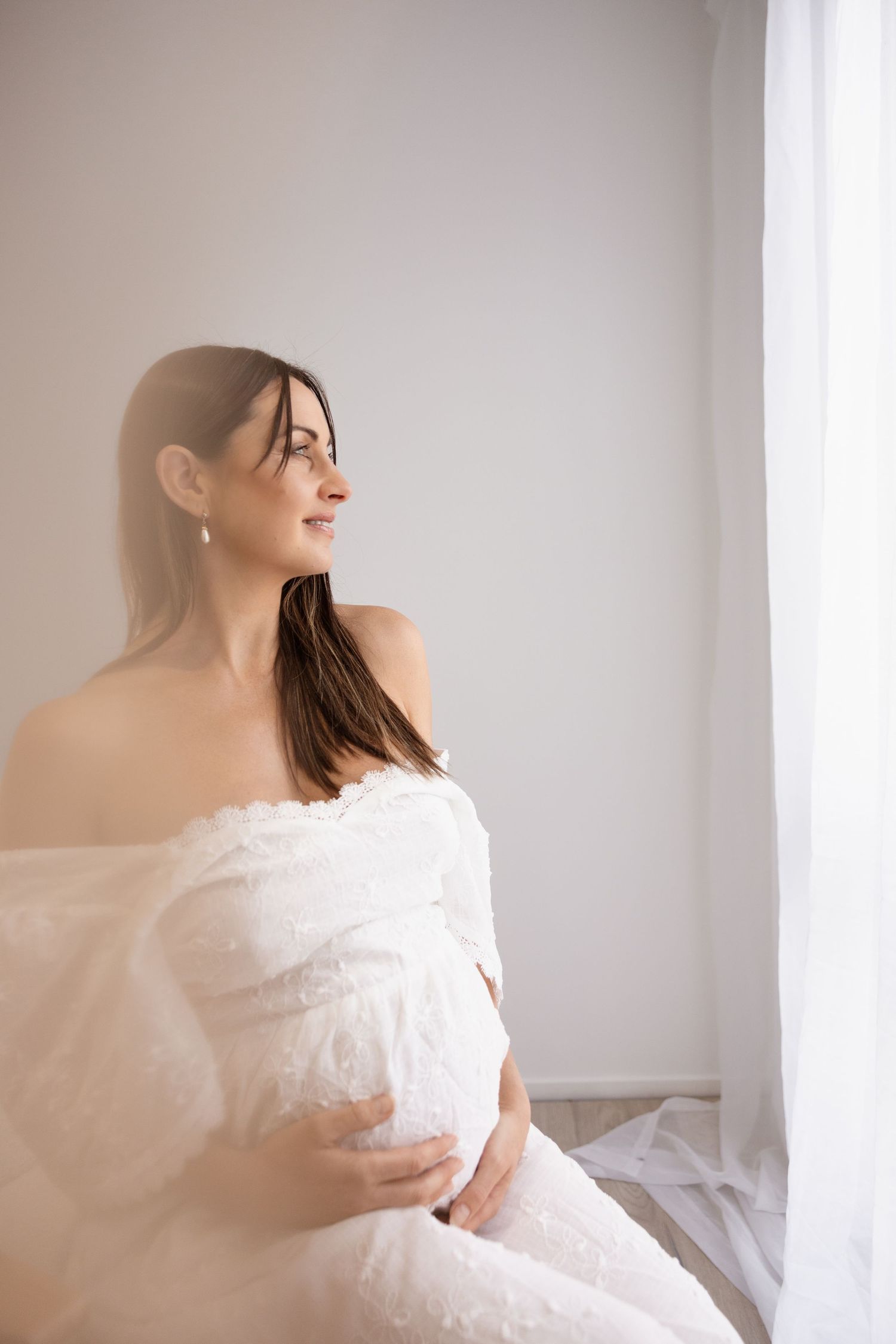 Studio maternity session in Christchurch, client wearing a dress from client wardrobe