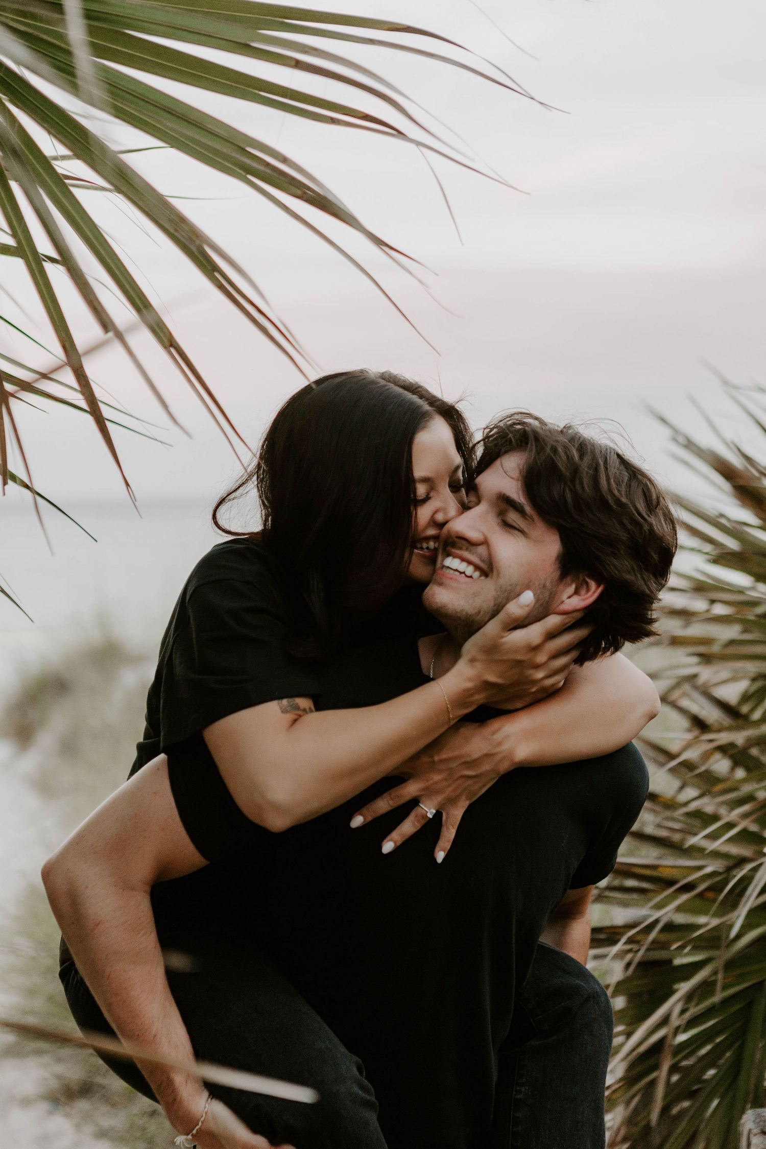 Couples photo session, partners giving a cheek kiss in Panama City Beach, Florida