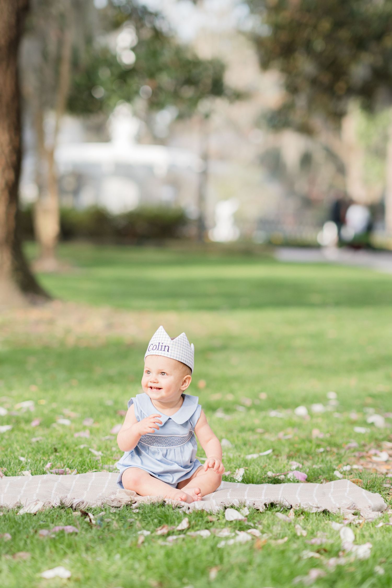 two year old milestone photos taken in front of park at forsyth park in savannah georgia.