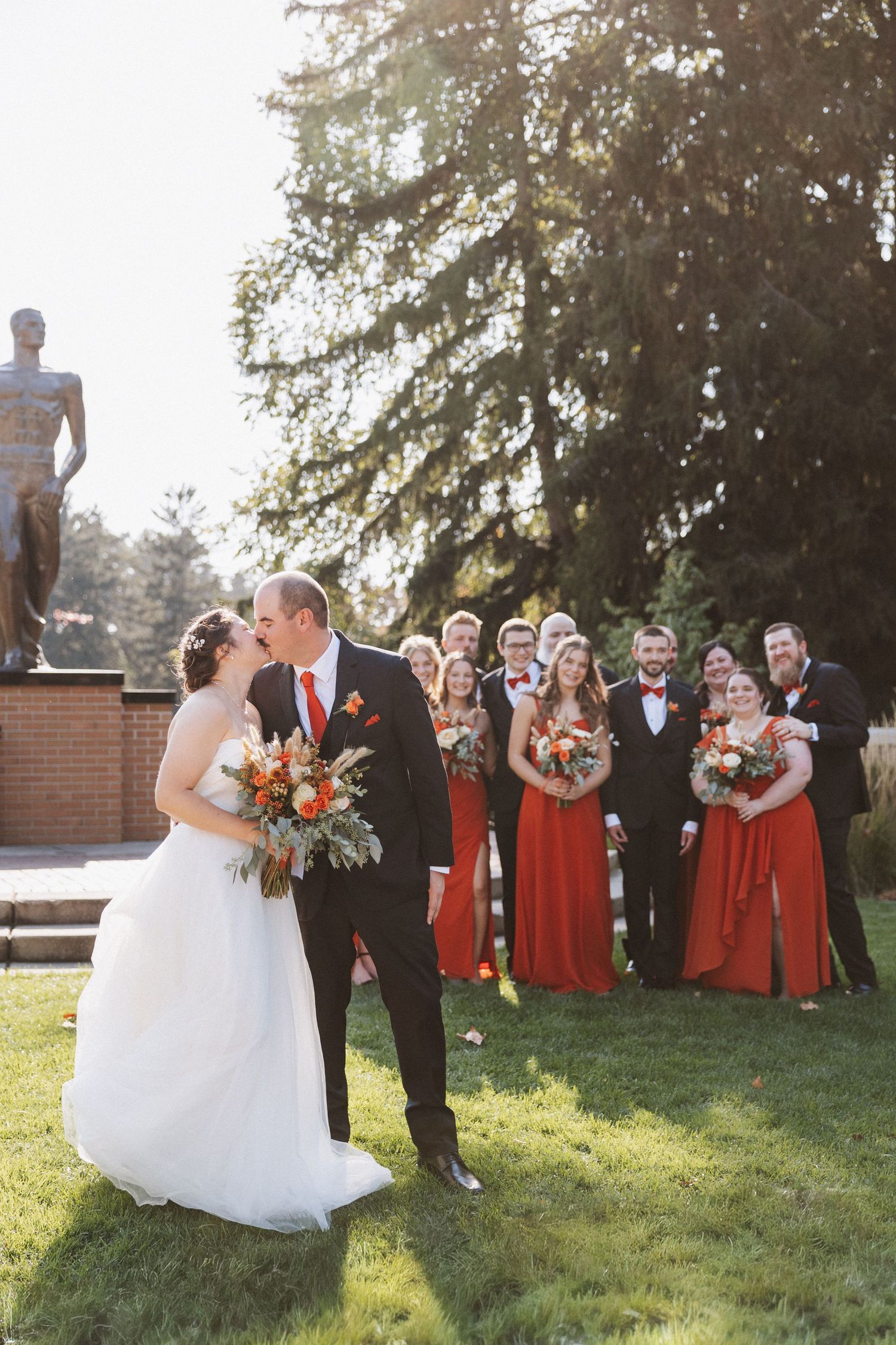 Couple embraces outside Spartan Stadium in Lansing. Metro Detroit Wedding Photographer