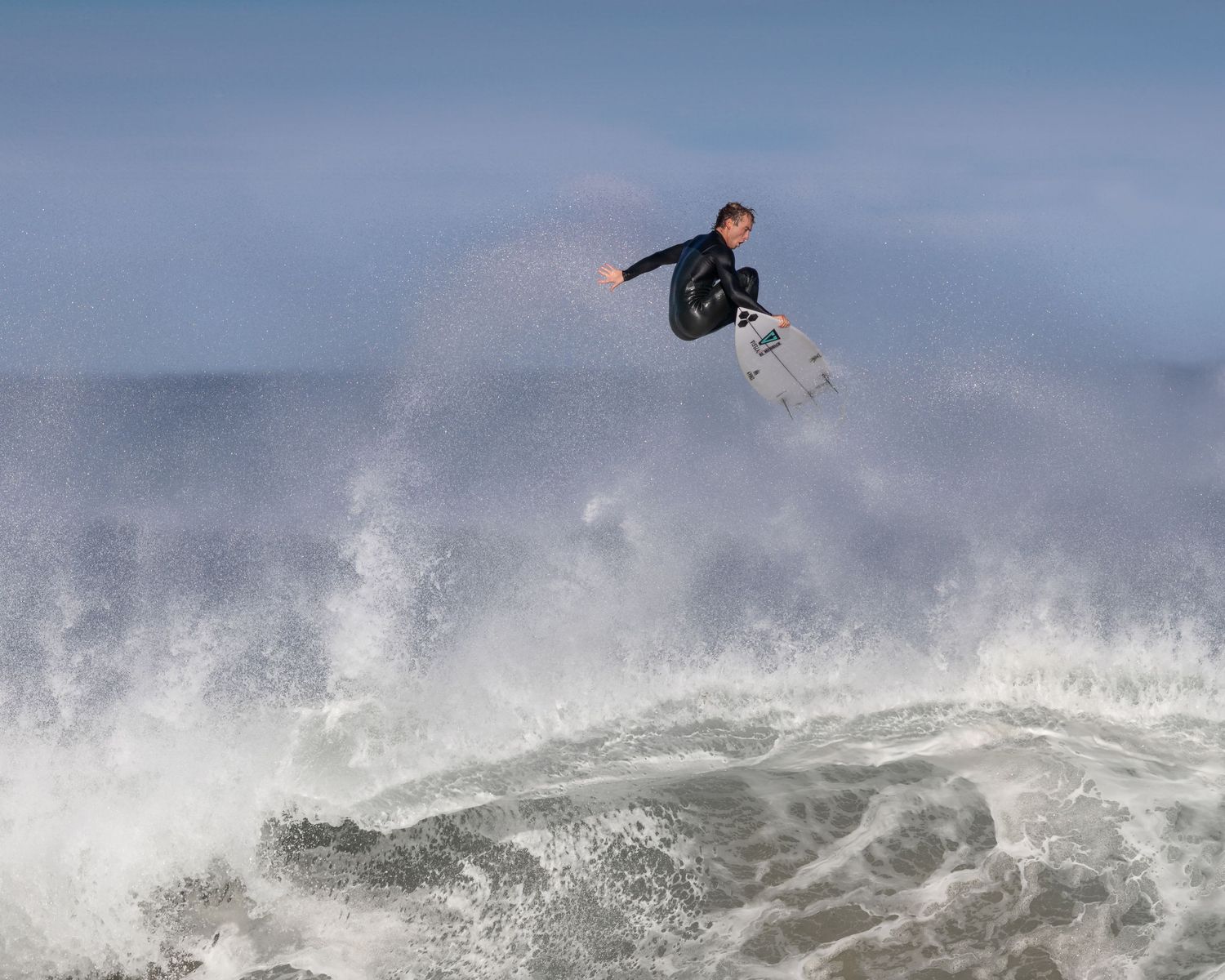Pro surfer Jordy Lawler boosting a massive air at Narrabeen Beach — surf photography, Northern Beaches Sydney