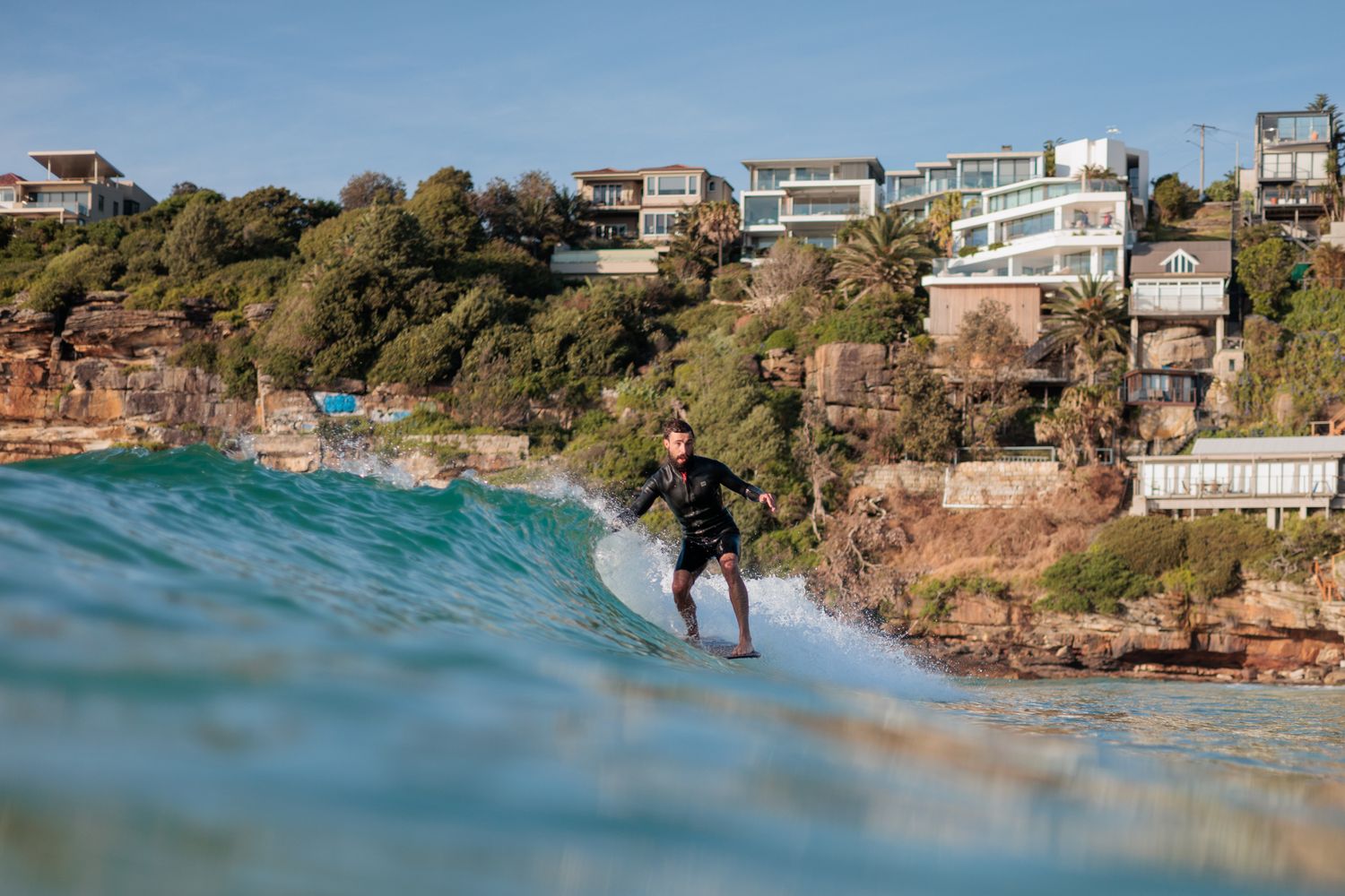 Surfer on the nose of a longboard, in the pocket at Freshwater Beach