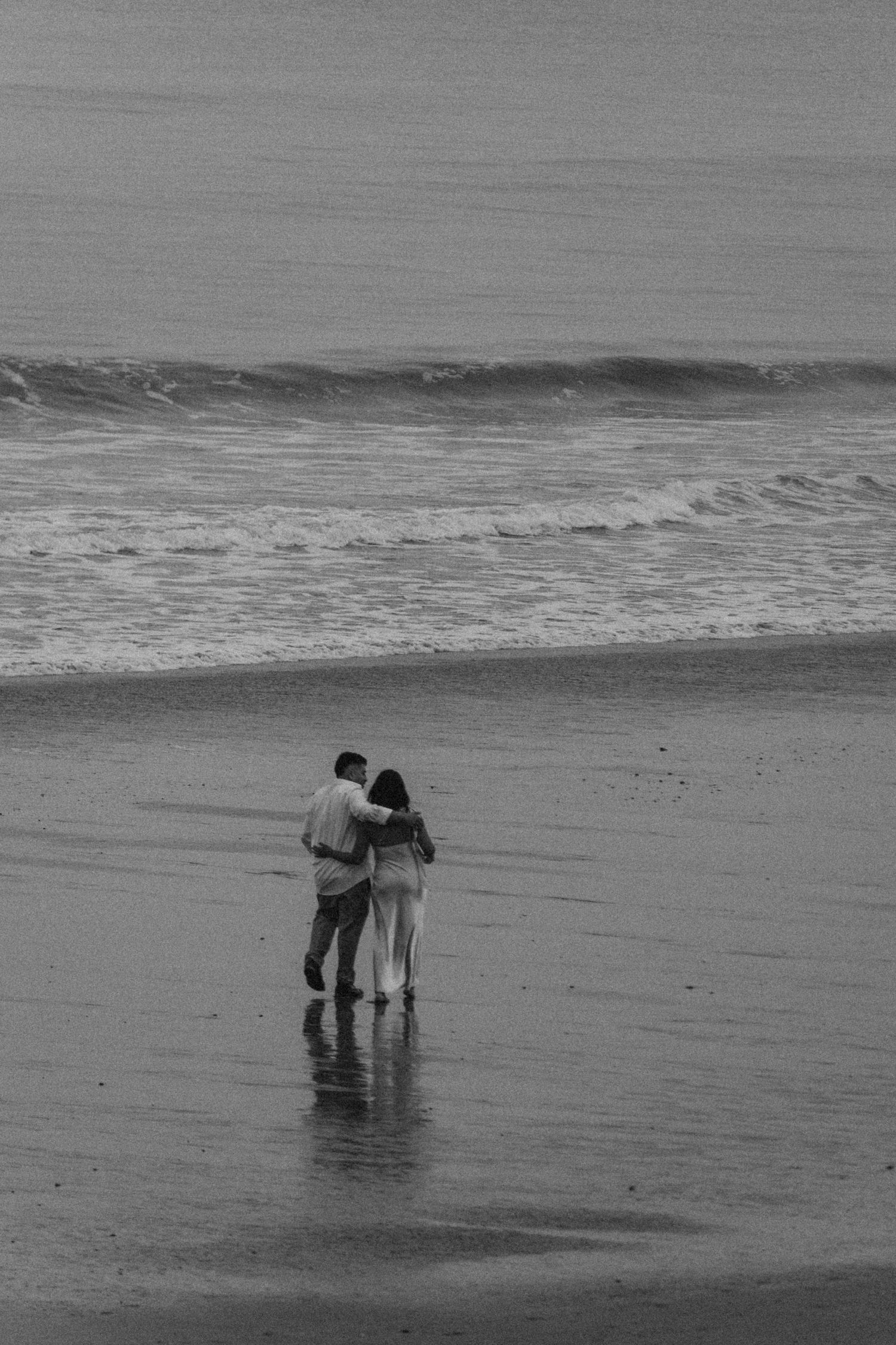Soft, grainy black and white portrait of a couple, capturing quiet connection and emotion.