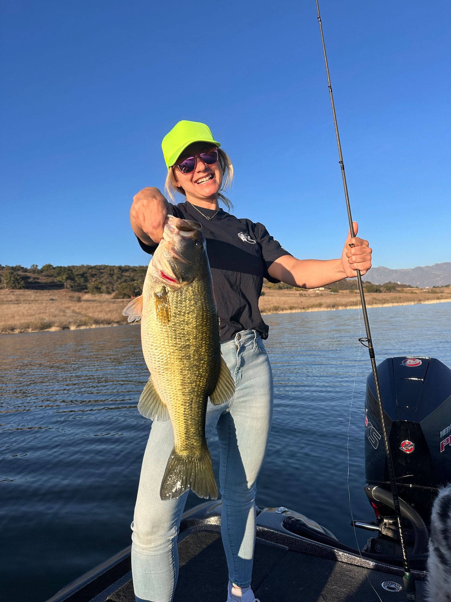 A sequence of fishing photos showing multiple large bass catches on a calm lake with mountains in the background.
