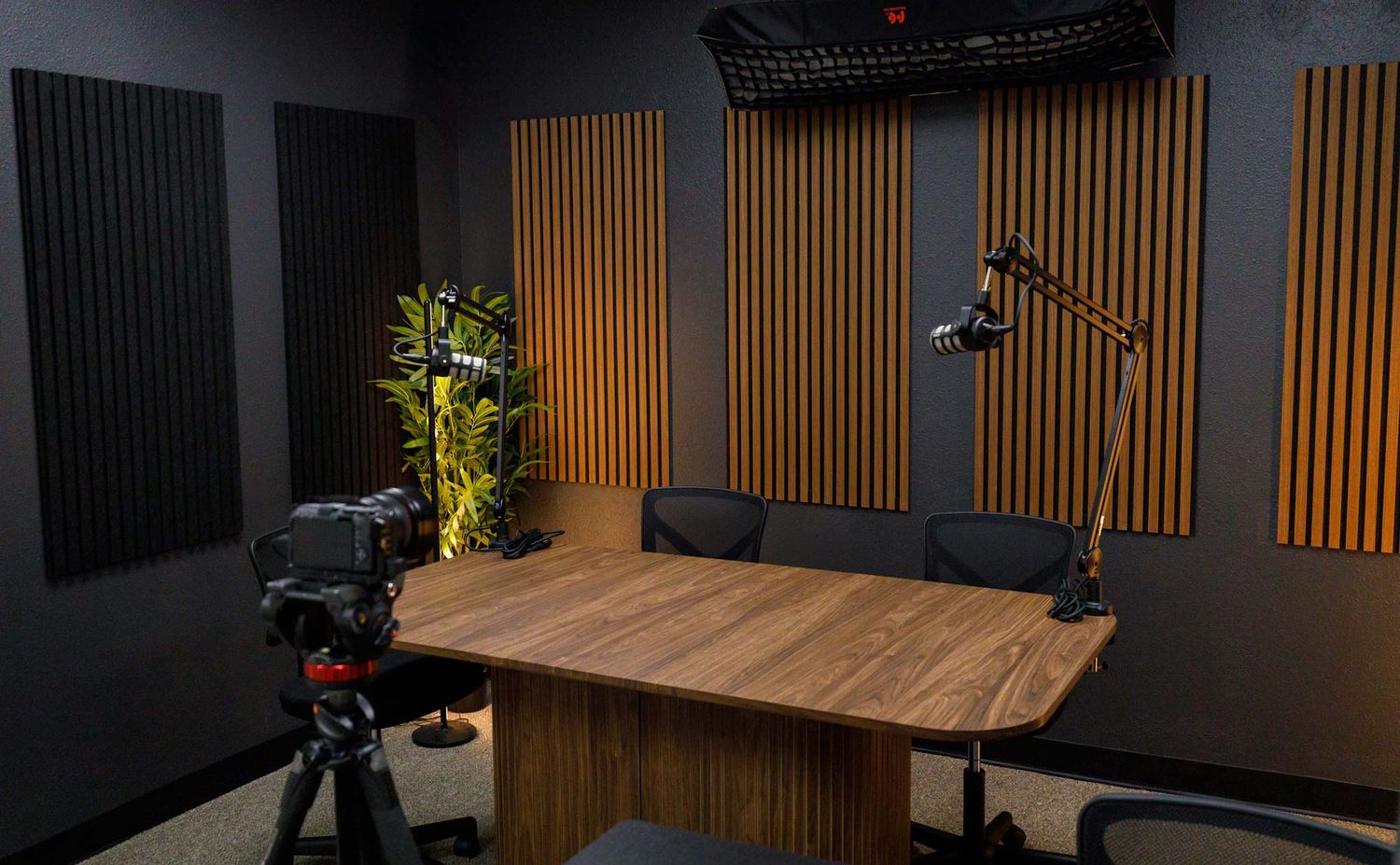 Four-person video podcast recording studio rental in Seminole FL with professional microphones and lighting