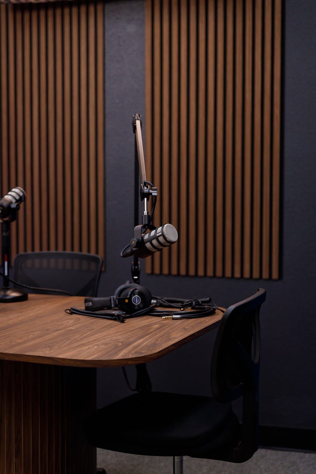 Podcast recording station with microphone and headphones in a Seminole FL podcast studio rental