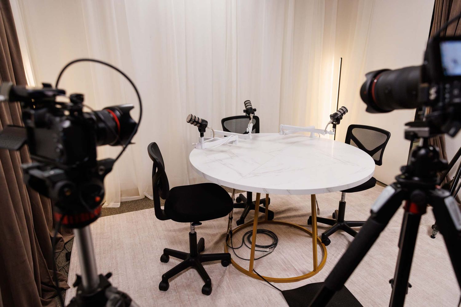 Three-person video podcast recording setup at The Pod Life by Lockwood Studios in Seminole FL