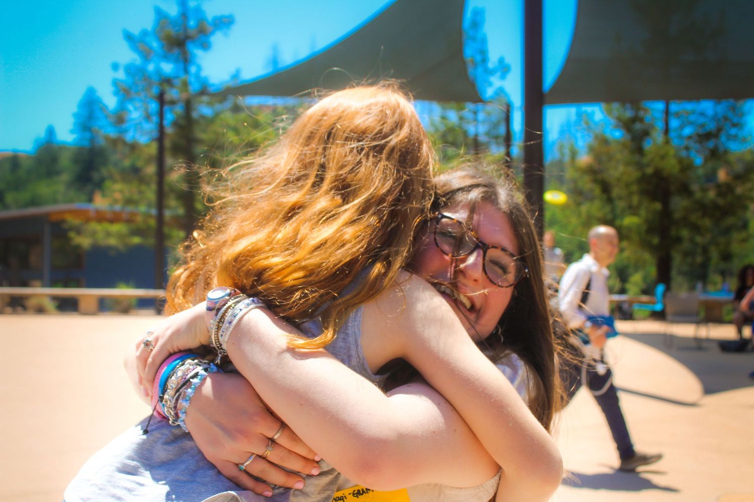 Two girls hugging.