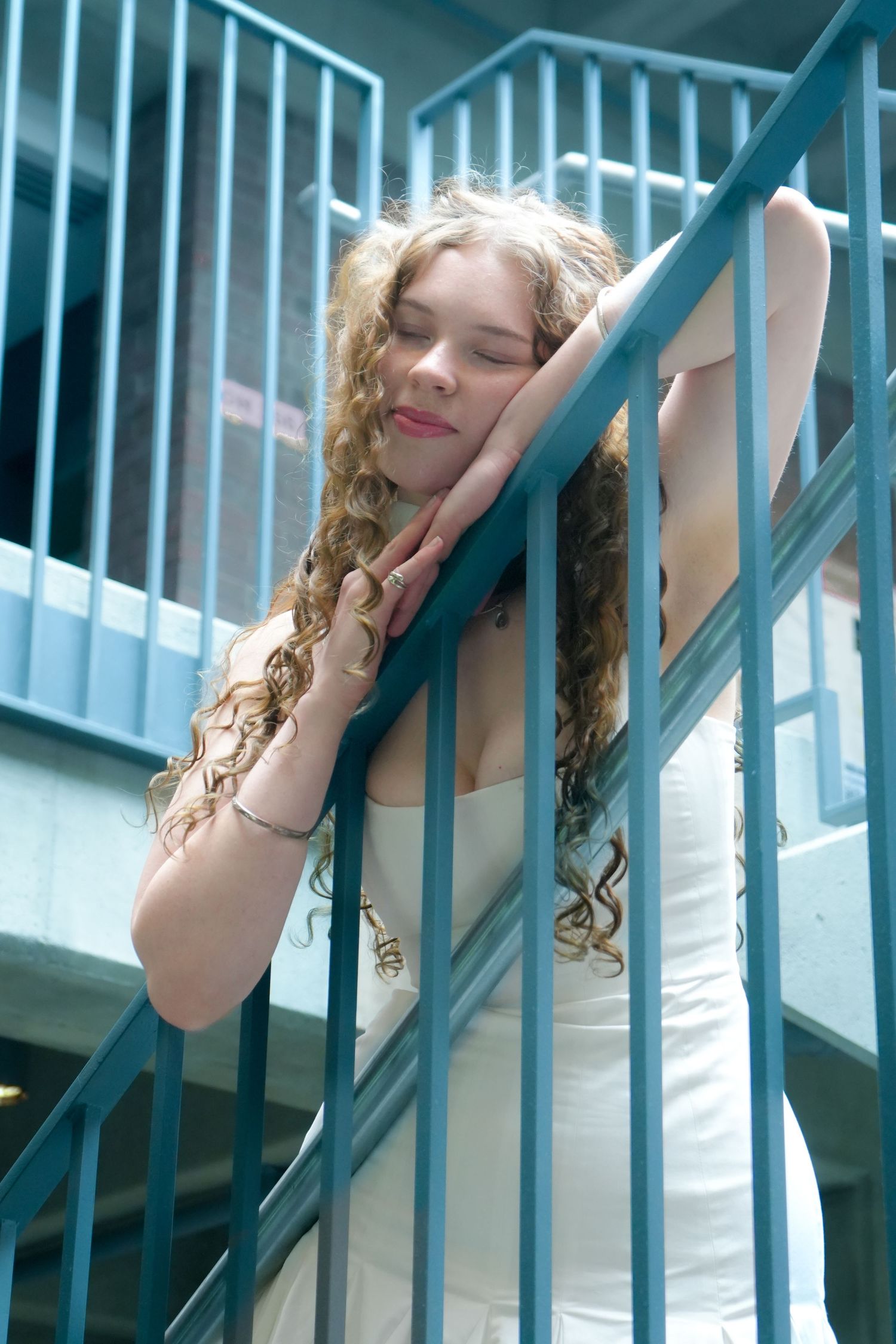 A woman posing under the light.