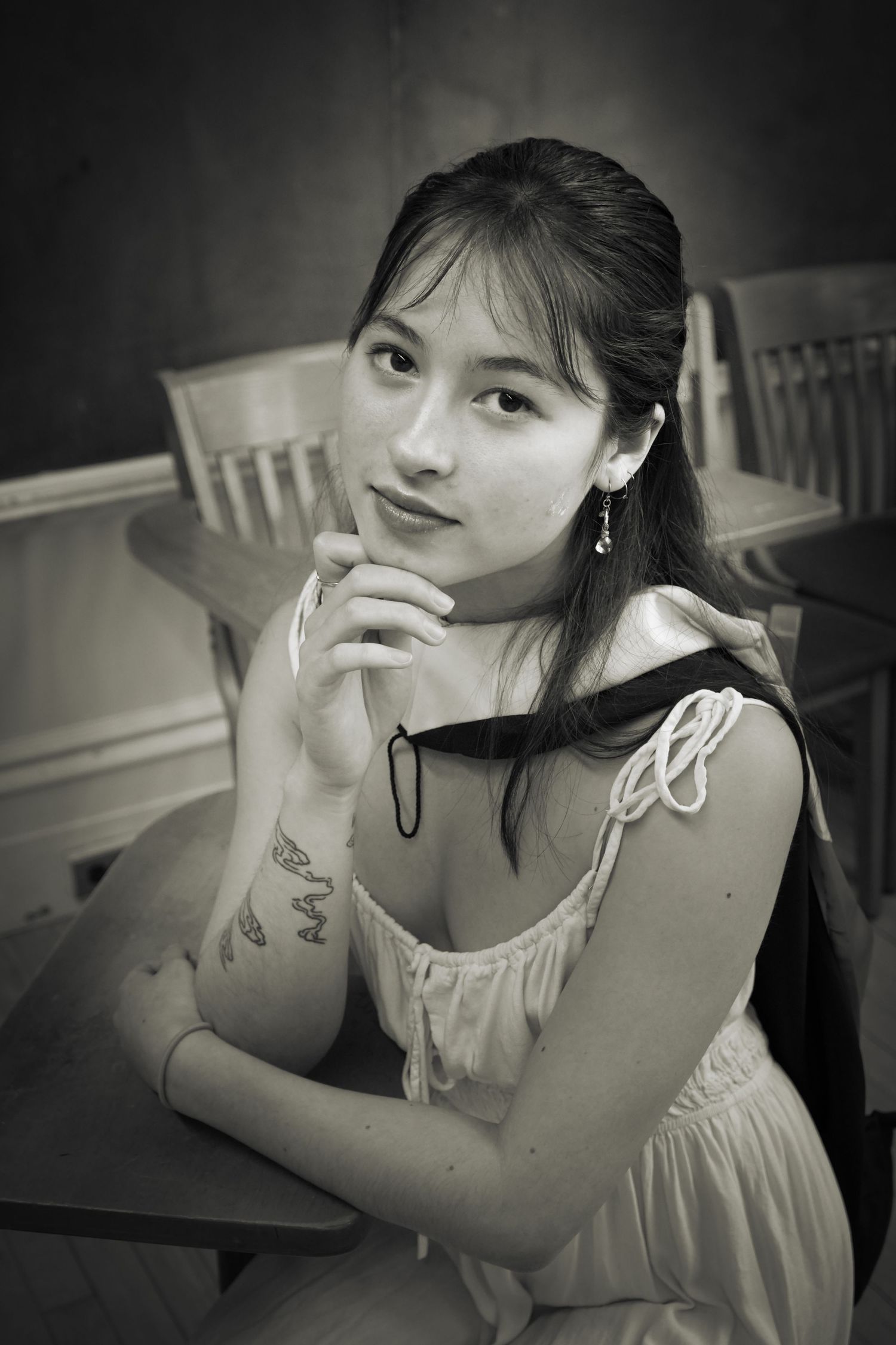 A woman posed in a classroom.