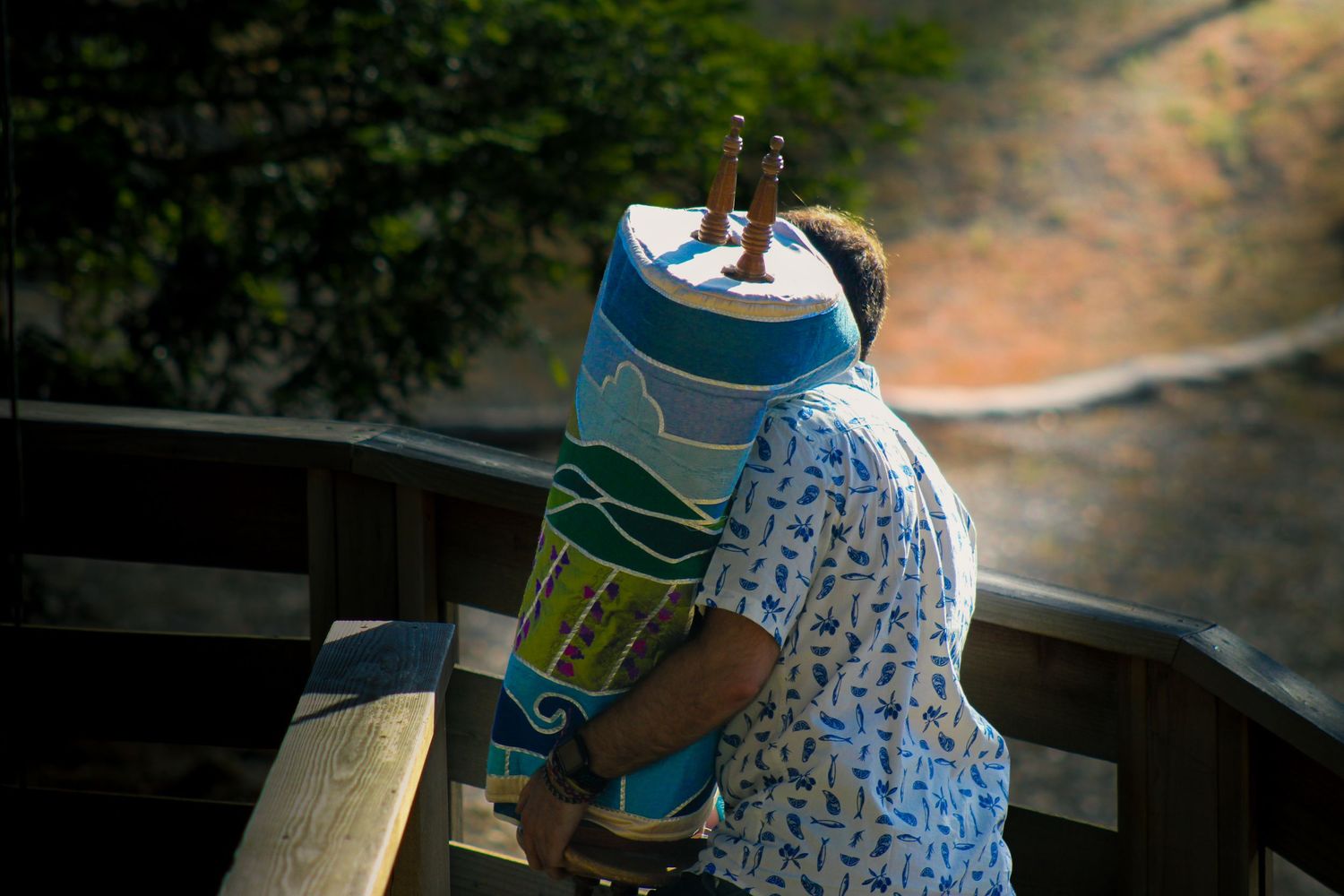 Someone carrying a Torah.