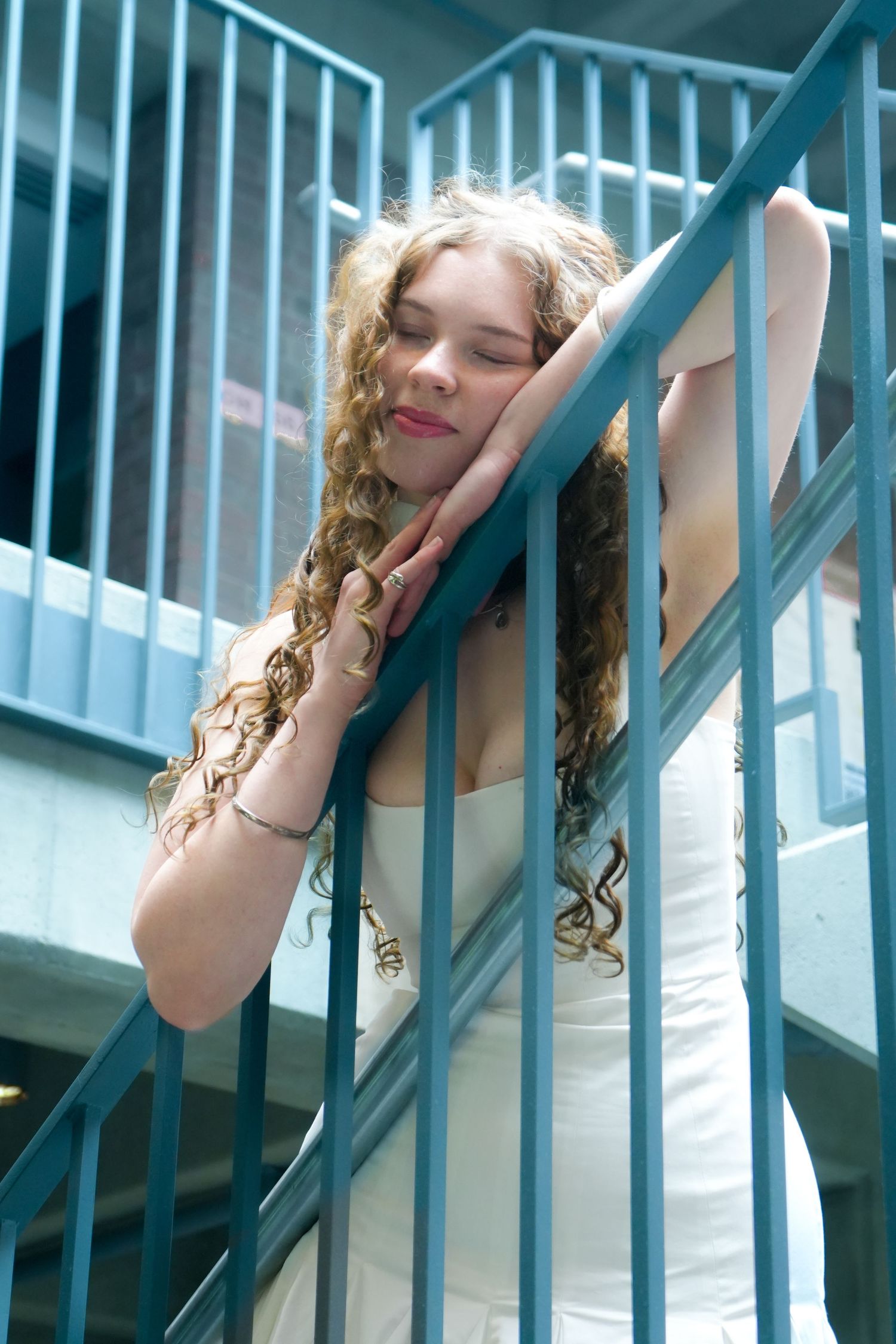 A woman posing under the light.