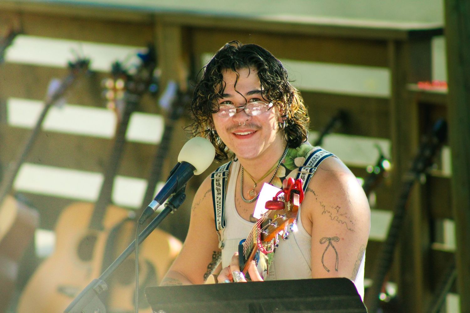 A person with a guitar singing.