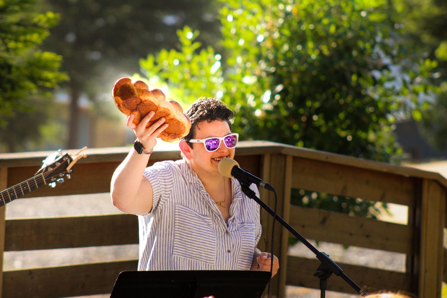 Someone holding up a Challah.