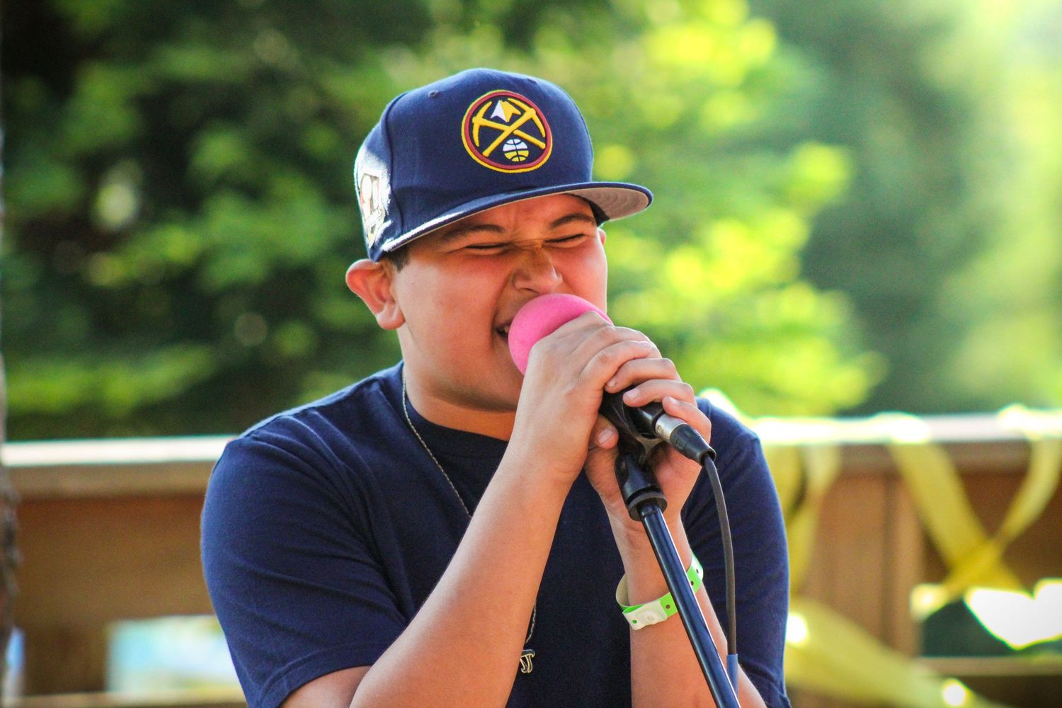 A boy singing into a mic.