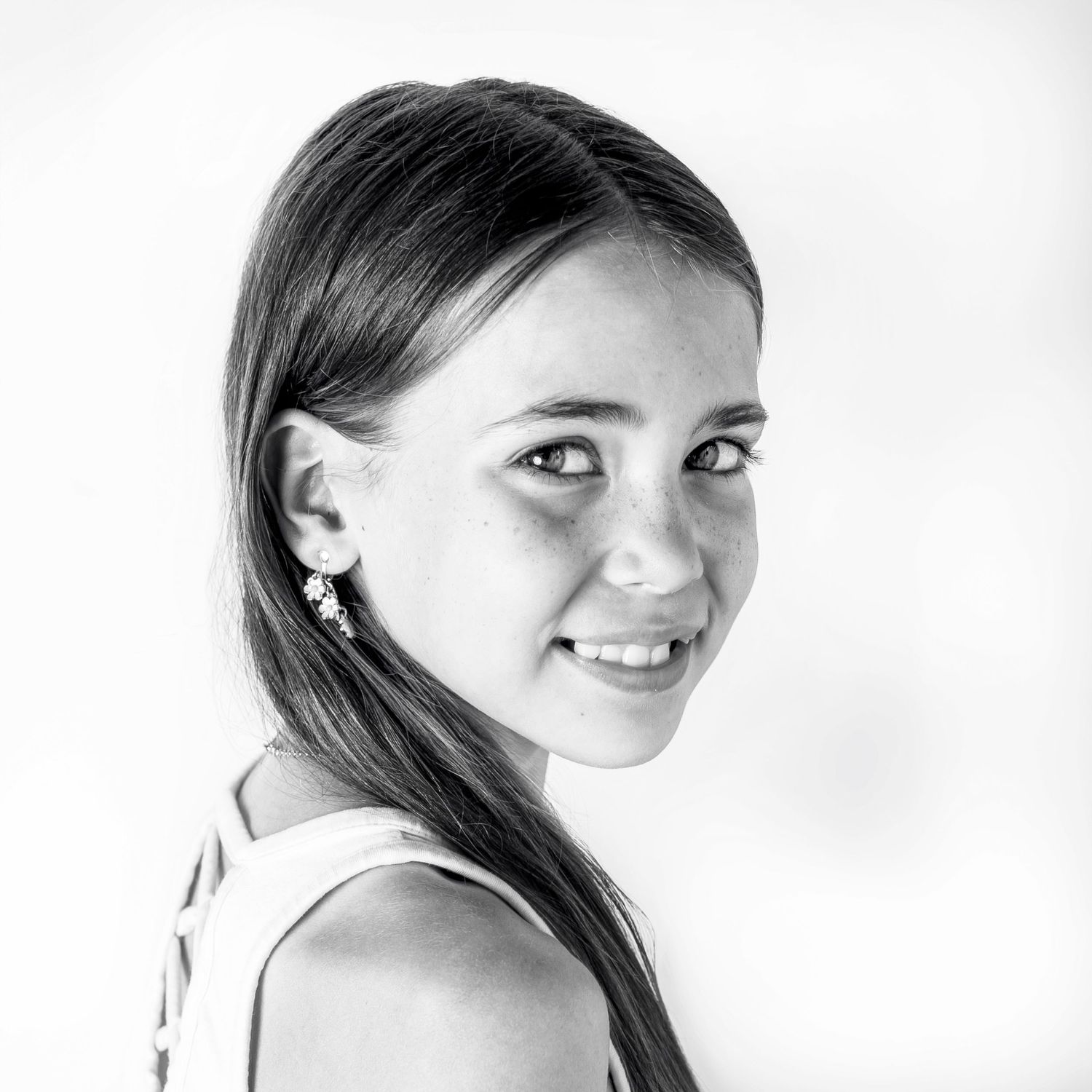 Black-and-white portrait of happy girl at Classic Littles children's portrait session.