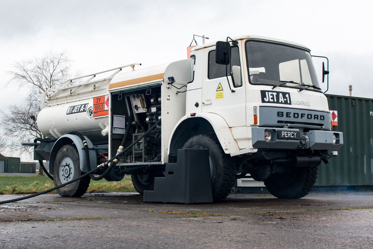 White Bedford tanker truck parked on concrete surface.