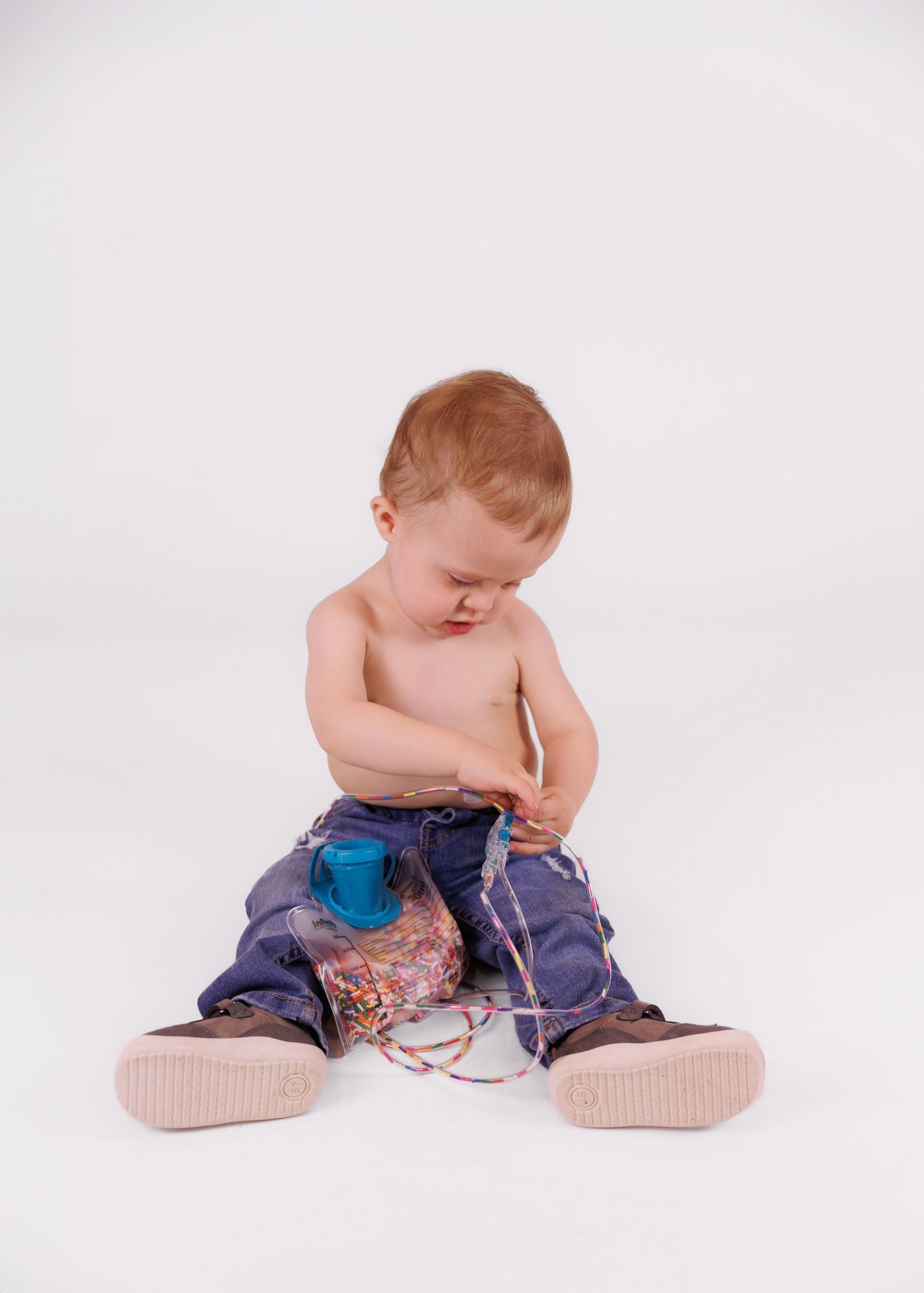child with feeding tube bag filled with sprinkles