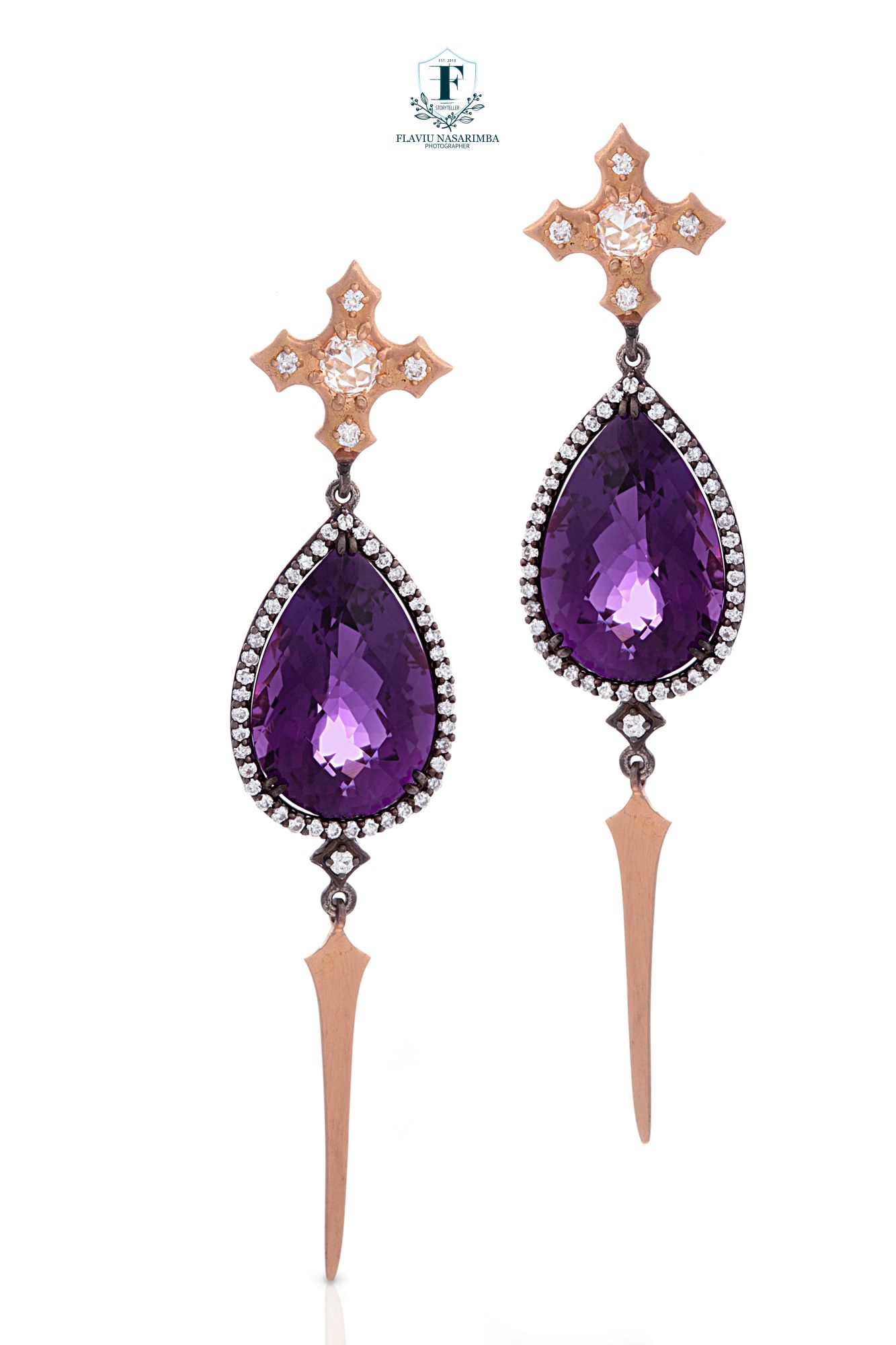 Statement drop earrings with large amethyst pear-cut stones, diamond halos, rose gold crosses, and spike drops.