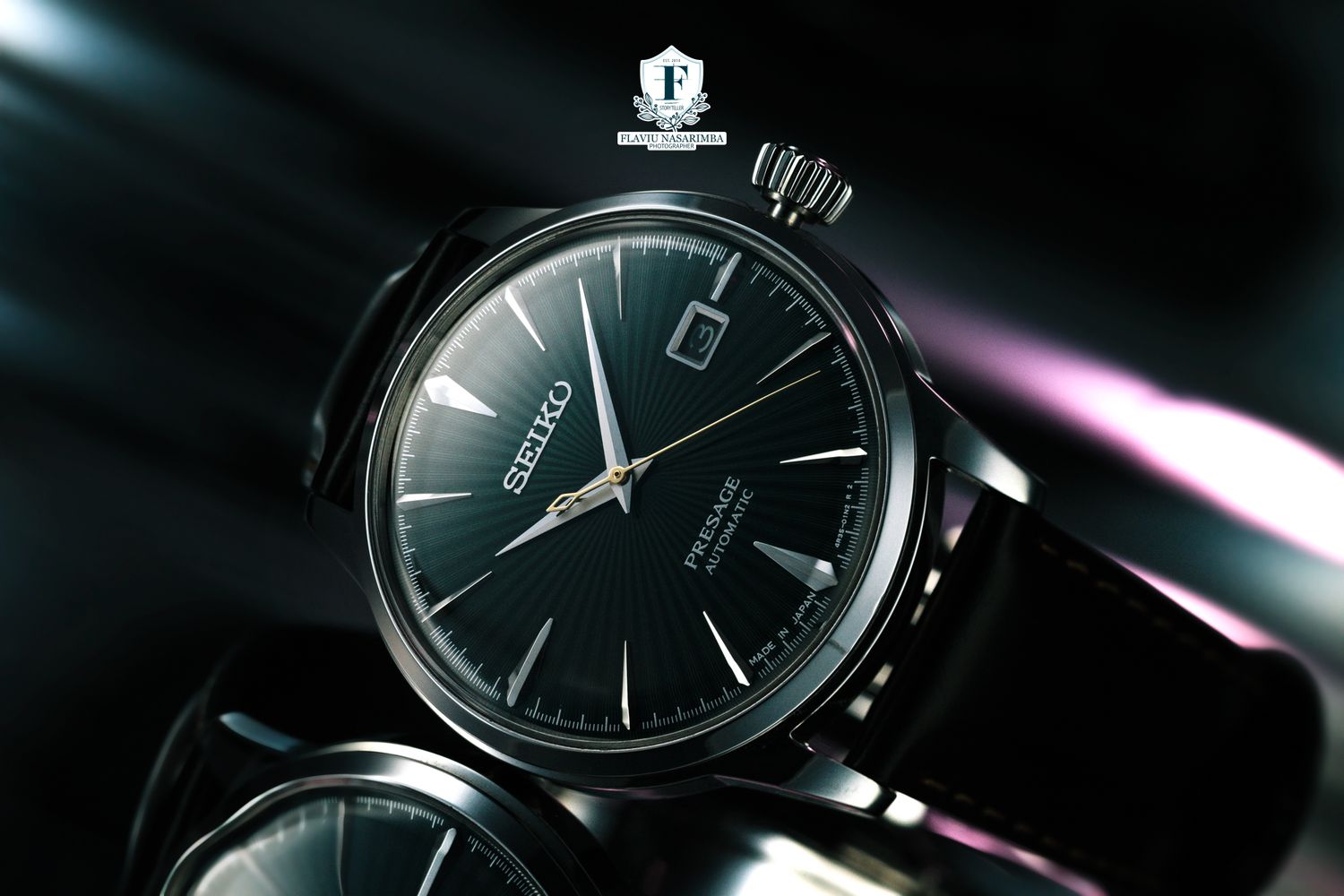 Seiko Presage dress watch with black dial and date window on leather strap in moody dark lighting.