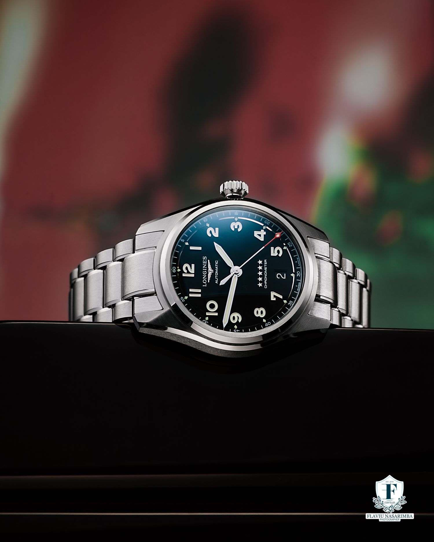 Longines Spirit stainless steel watch with blue dial displayed on dark presentation box.