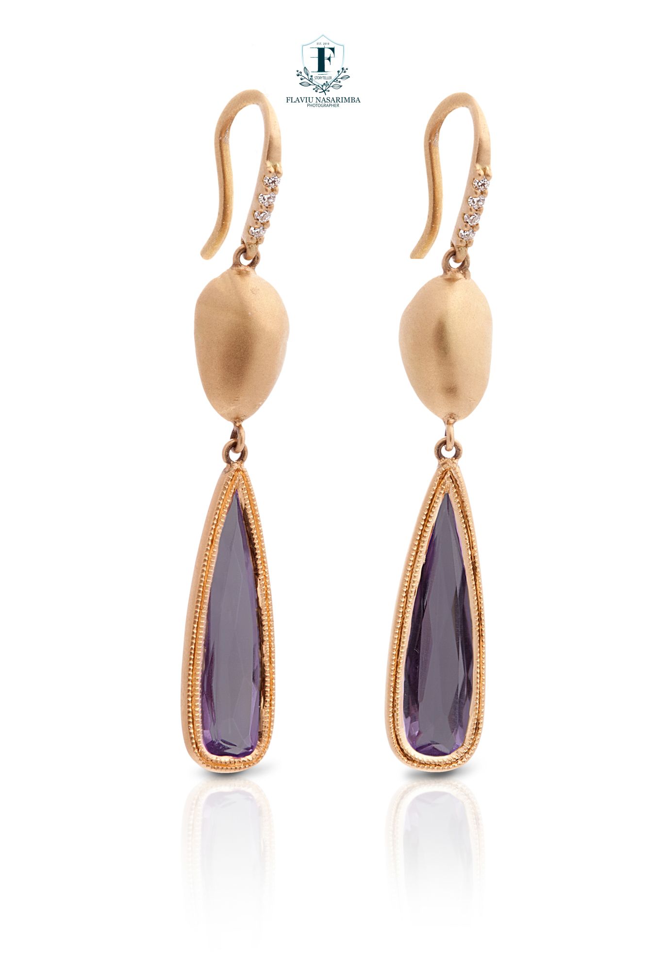 Rose gold drop earrings with matte oval tops, diamond accents, and elongated teardrop amethyst pendants.