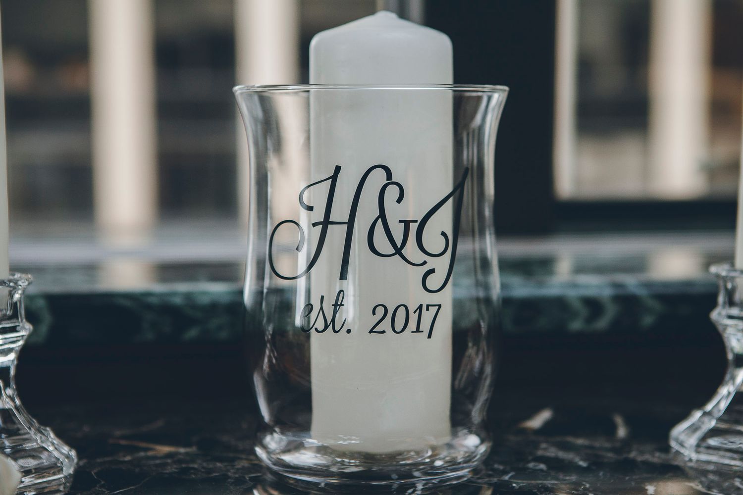 Personalized wedding unity candle with H&G monogram and est. 2017 in glass hurricane vase.