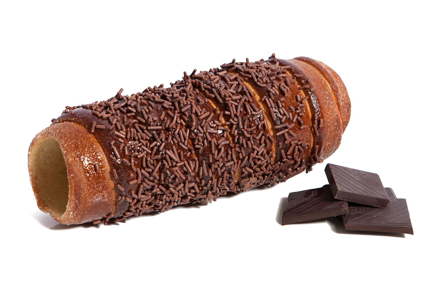 Cylindrical wafer roll covered in chocolate sprinkles with dark chocolate pieces.