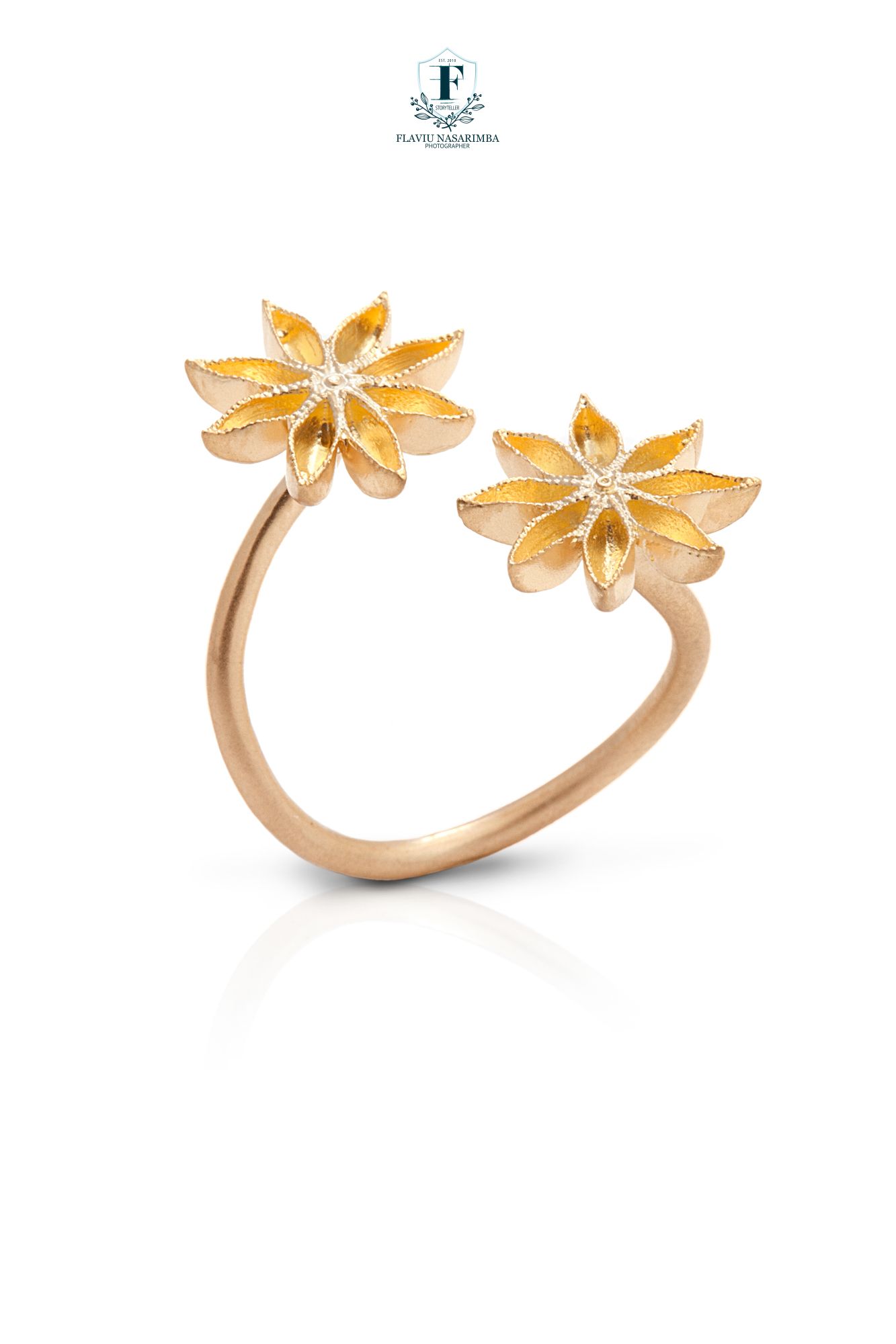 Pair of rose gold anise star flower stud earrings with delicate petal detailing and diamond centers.