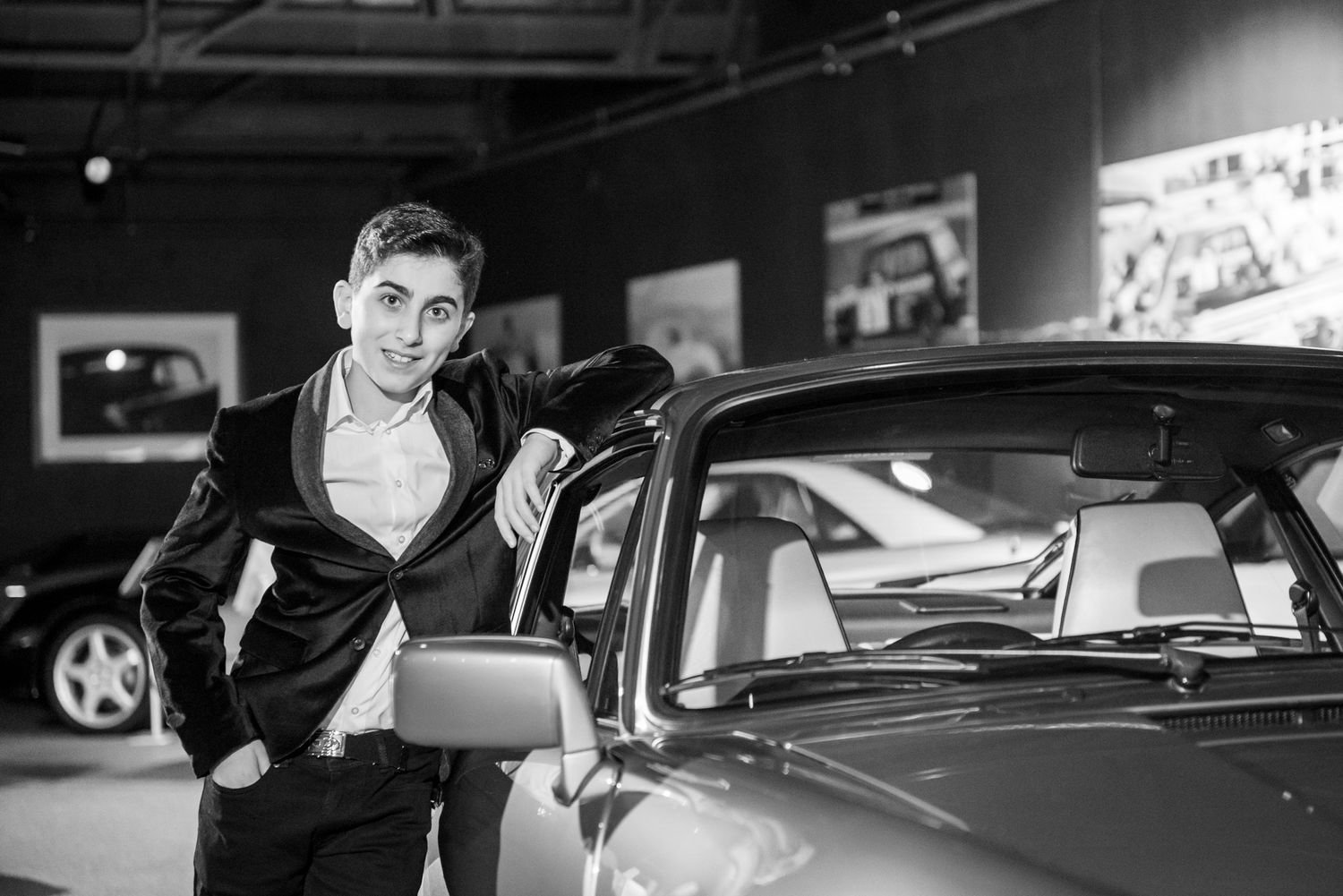 A collage of black and white photographs showing luxury cars and automotive scenes.