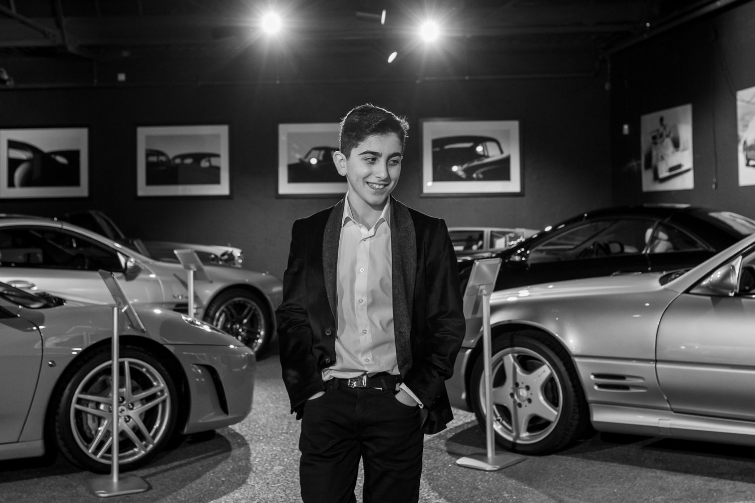 A black and white photo collage of luxury cars and figures in formal attire at an automotive event.