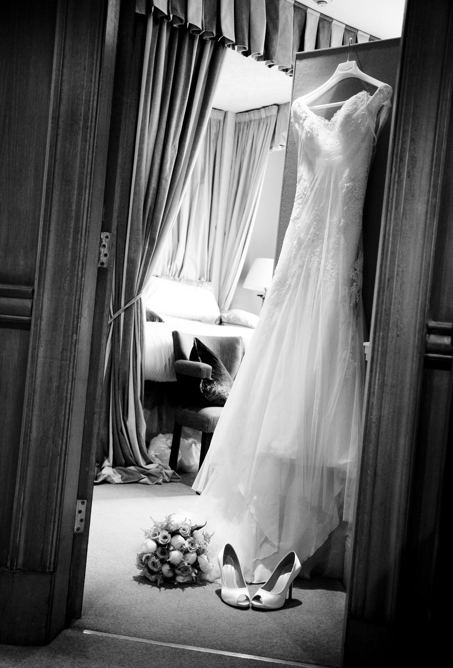 A series of black and white photographs showing elegant wedding dresses and bridal accessories arranged in a row.
