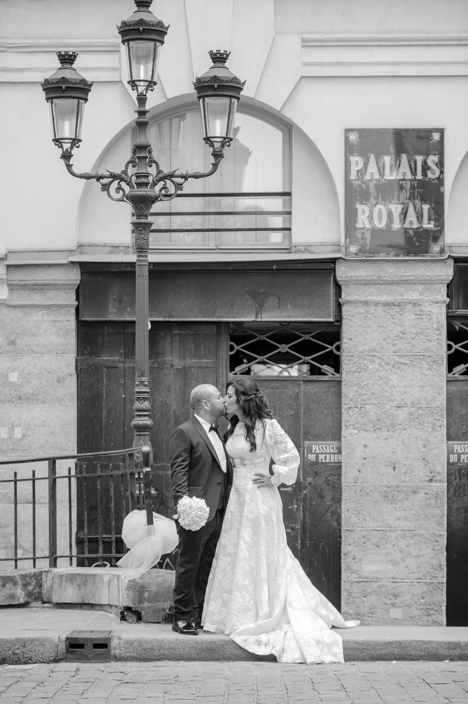 Vintage black and white wedding photos showing romantic moments outside Palais Royal in Paris.